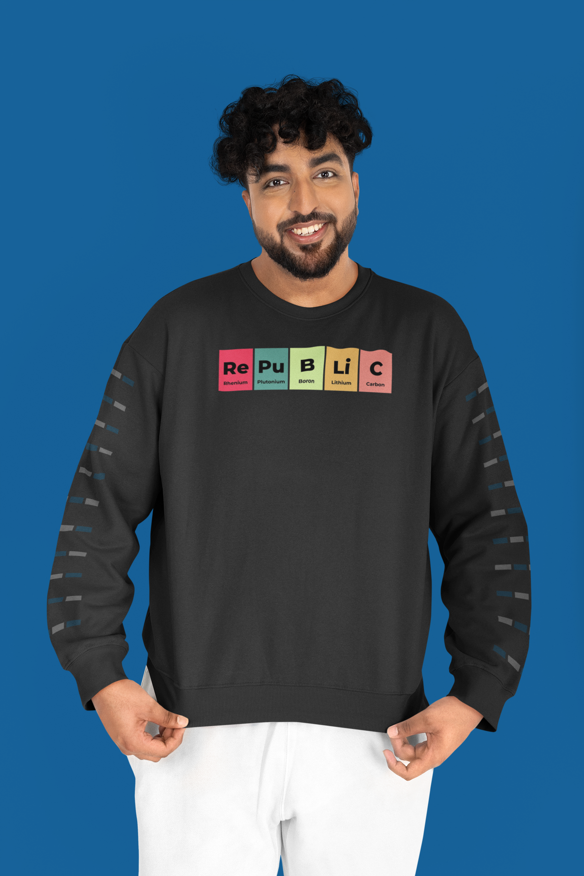 'Republic' periodic table sweatshirt in charcoal, man wearing it on a blue background, funny science gift