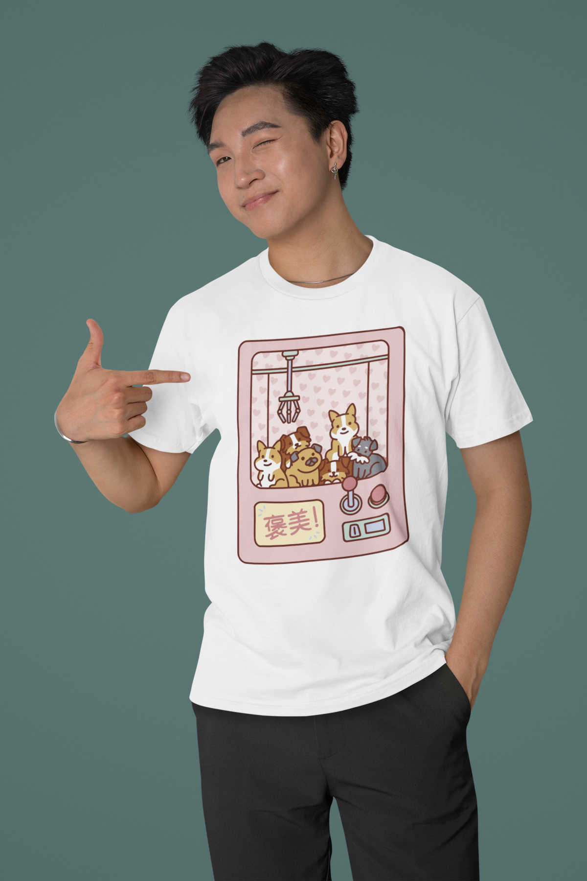 Cute Claw Machine Dogs T-shirt in white, man wearing it against a green backdrop, dog lover gift shirt