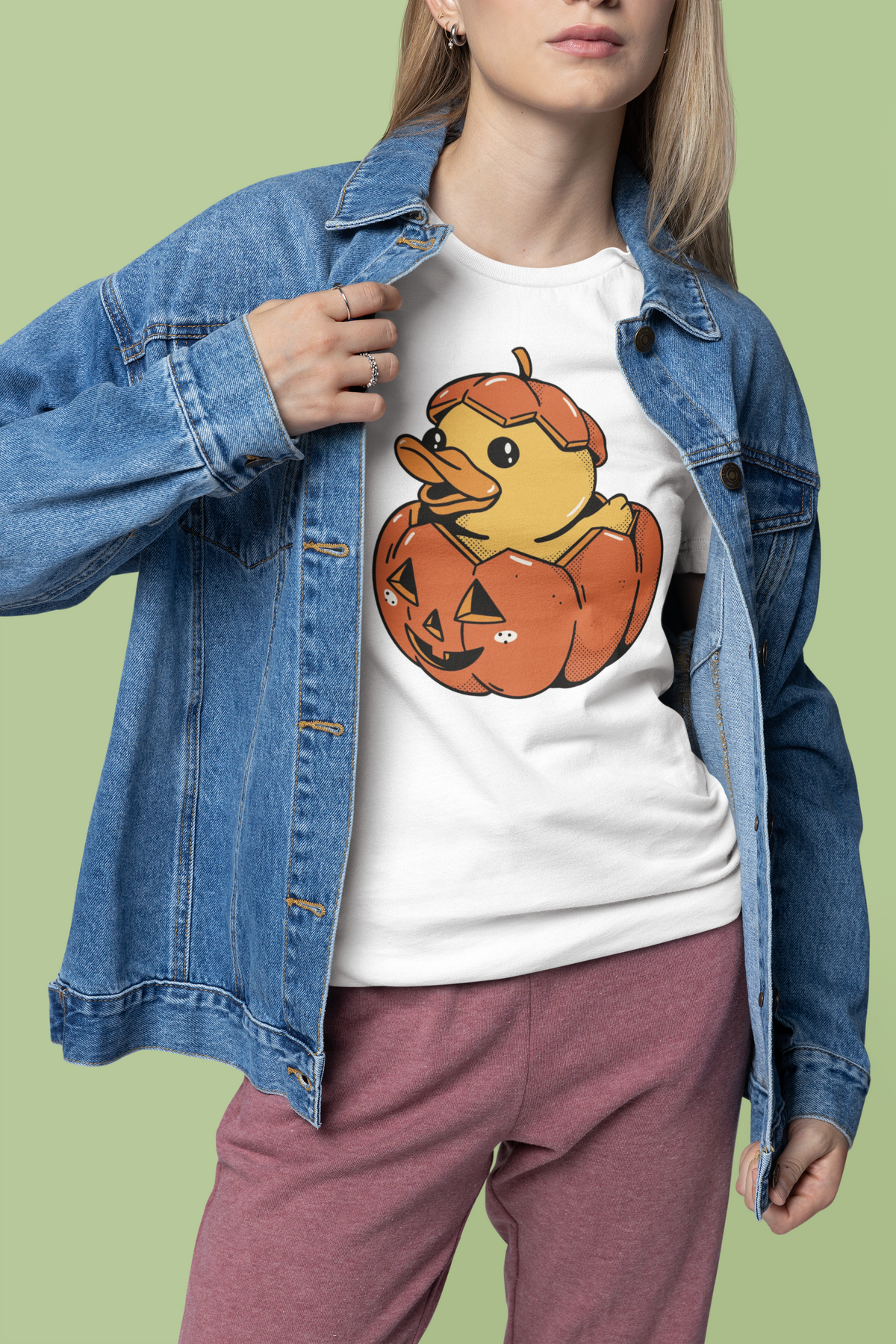 Halloween duck t-shirt in white, woman wearing it under an open denim jacket, funny spooky duck gift