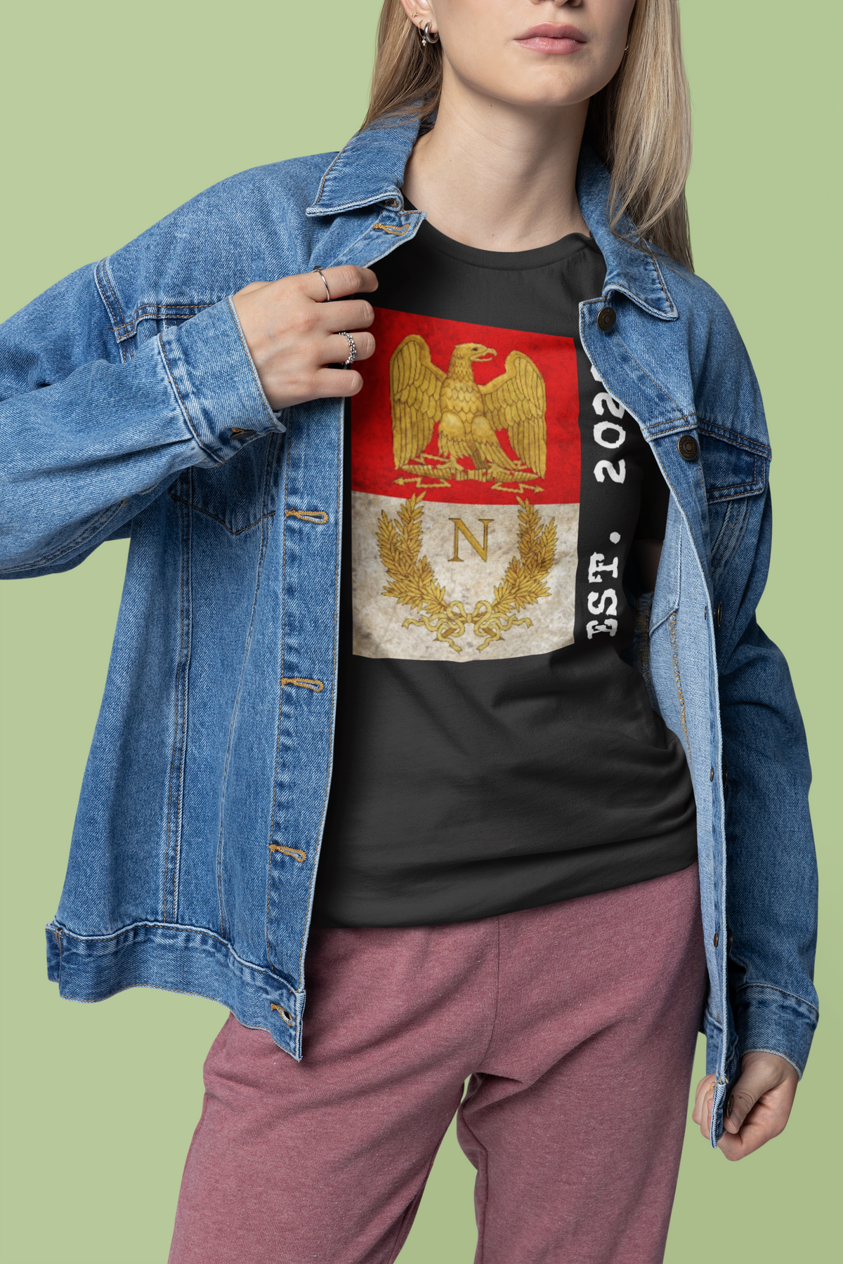 'Listenbourg Est. 2022' t-shirt in black, woman in denim jacket wearing it