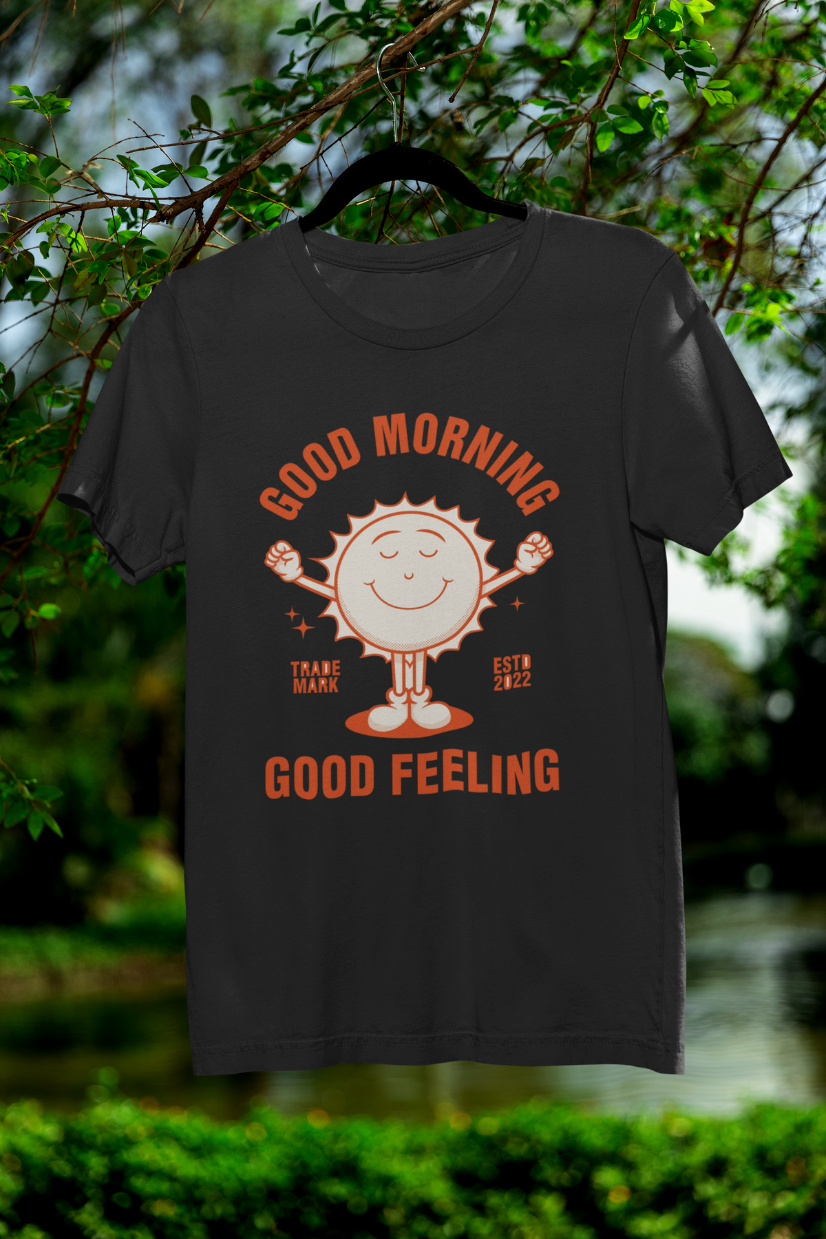 'Good Morning Good Feeling' sun t-shirt in black, hanging outdoors, uplifting positivity gift shirt