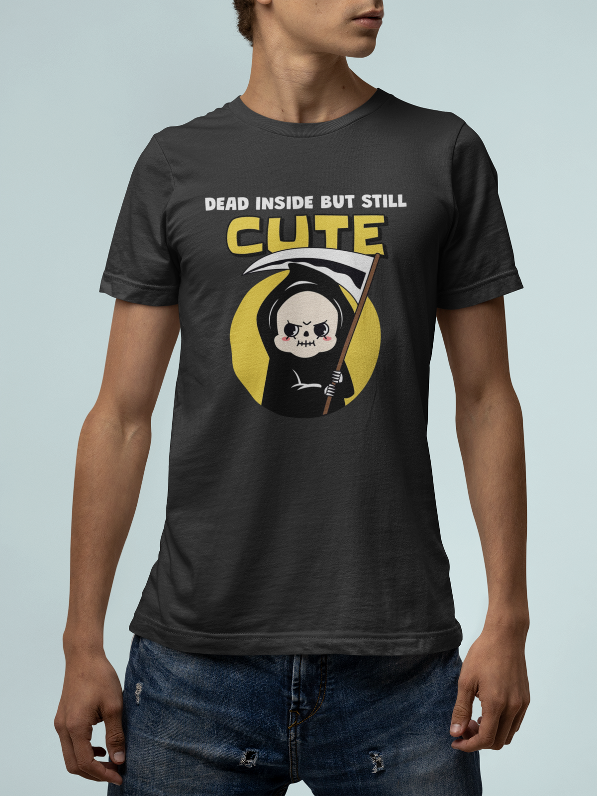 'Dead Inside but Still Cute' grim reaper t-shirt in light blue, man wearing it, dark humor tee gift