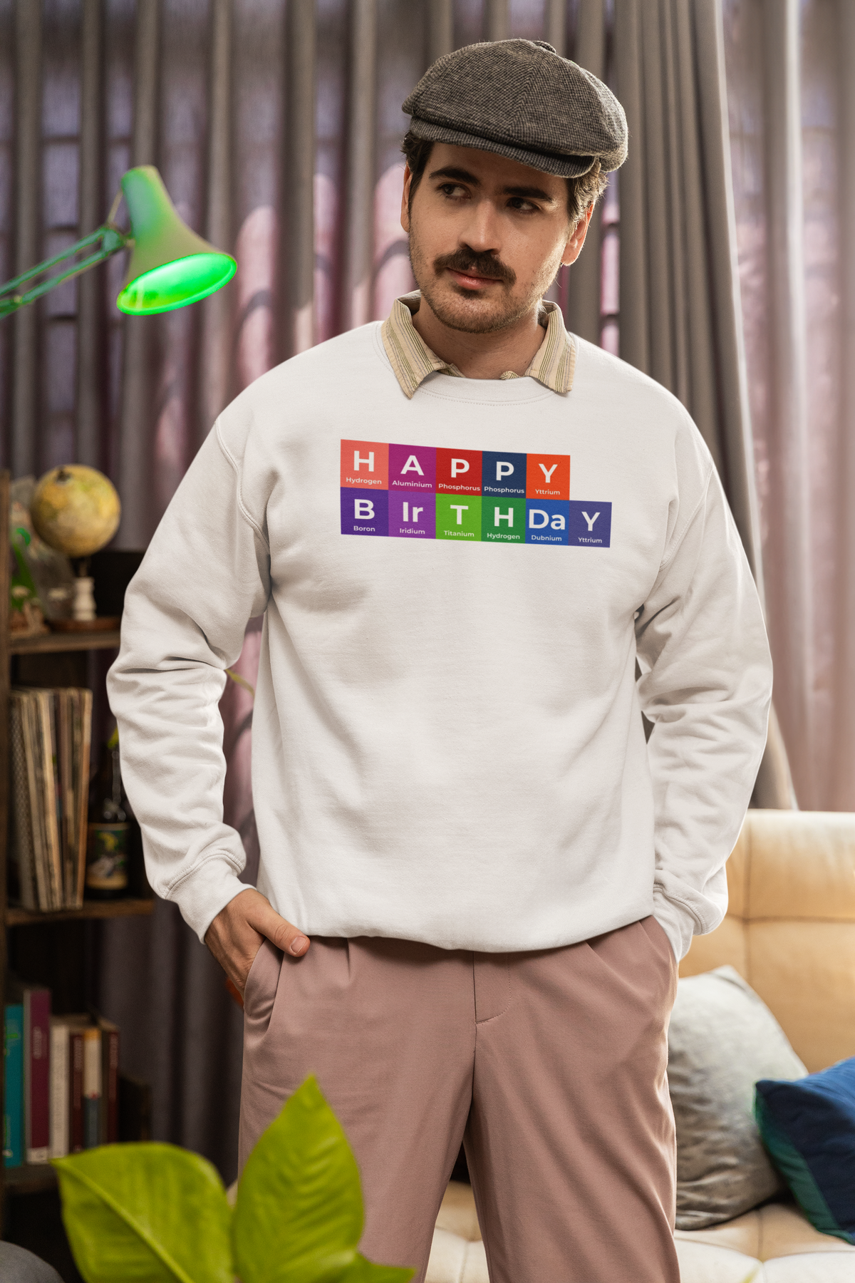 'Happy Birthday' periodic table sweatshirt in heather oatmeal, bearded man wearing it at home, science teacher gift