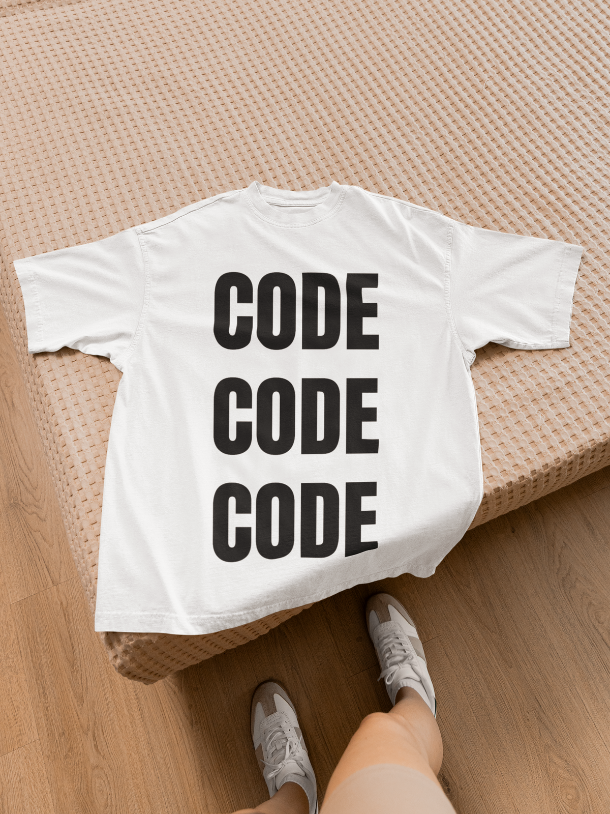 "Code Code Code" women's tee in white, back flat lay on a bed, funny programmer gift t-shirt