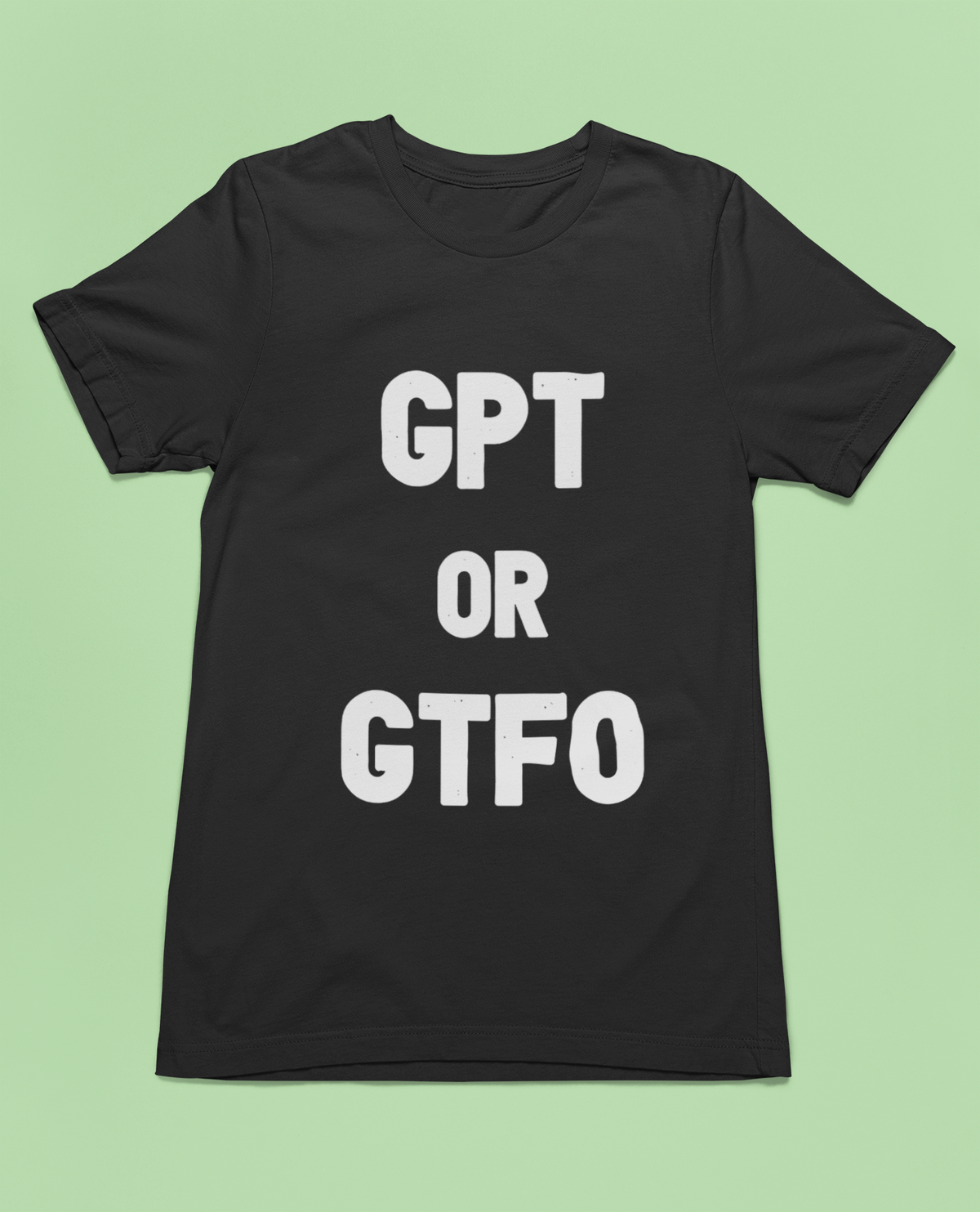 'GPT or GTFO' t-shirt in black, flat lay on green background, funny gift for tech lovers