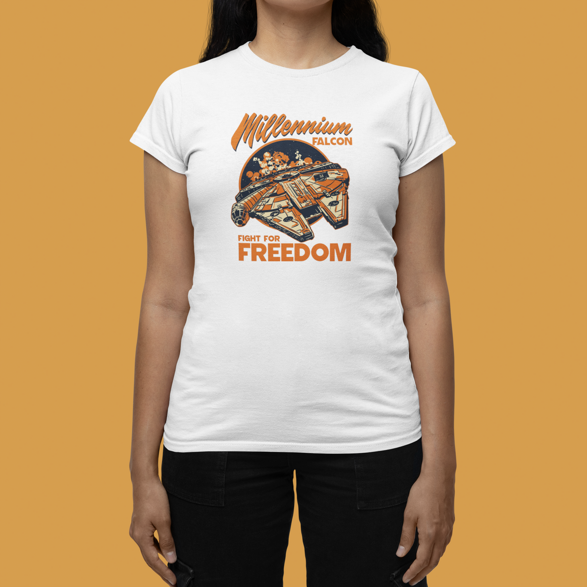 'Millennium Falcon Fight for Freedom' t-shirt in white, woman wearing it on mustard background, funny geek gift
