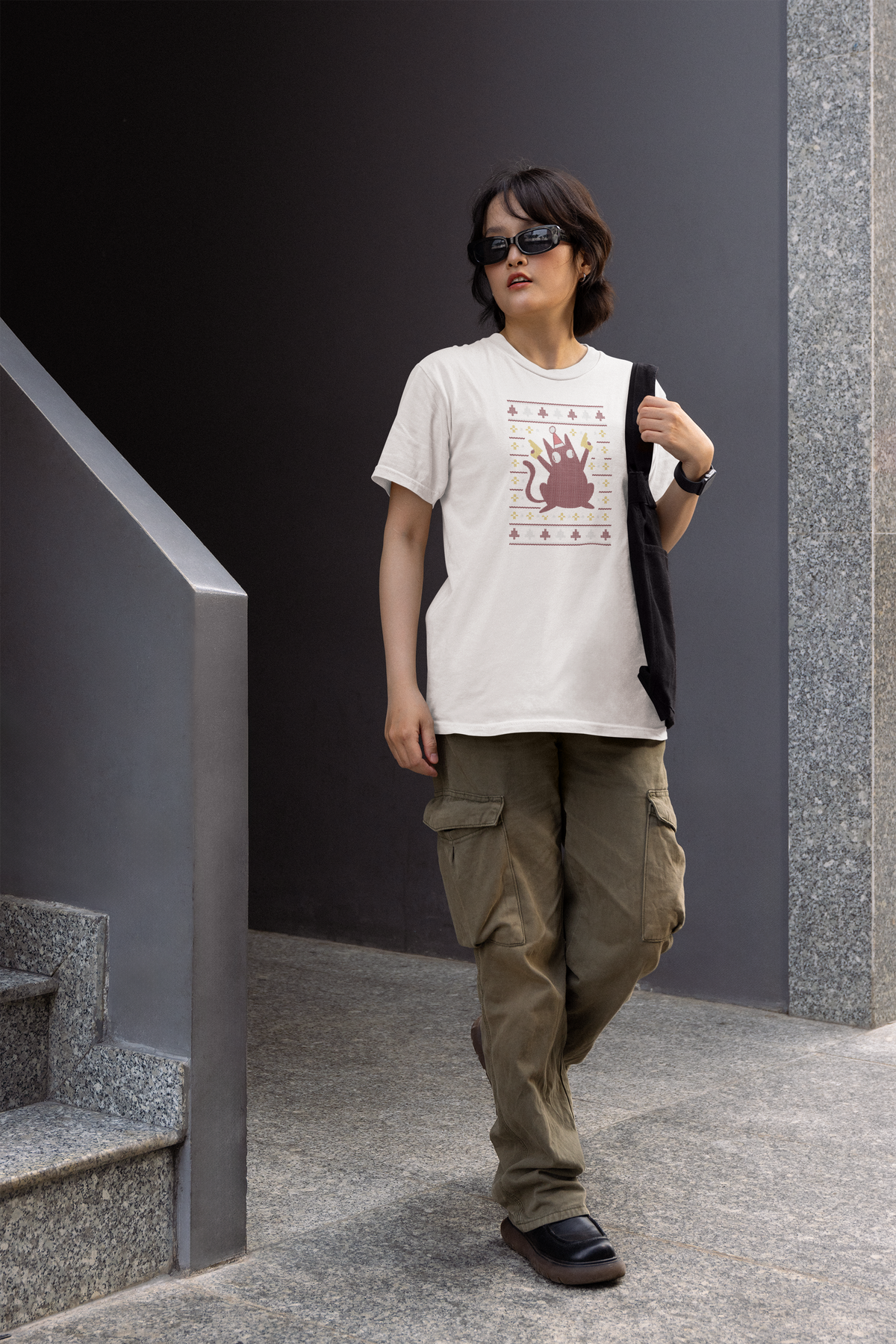 ugly Christmas sweater cat graphic graphic tee, model wearing it in natural light