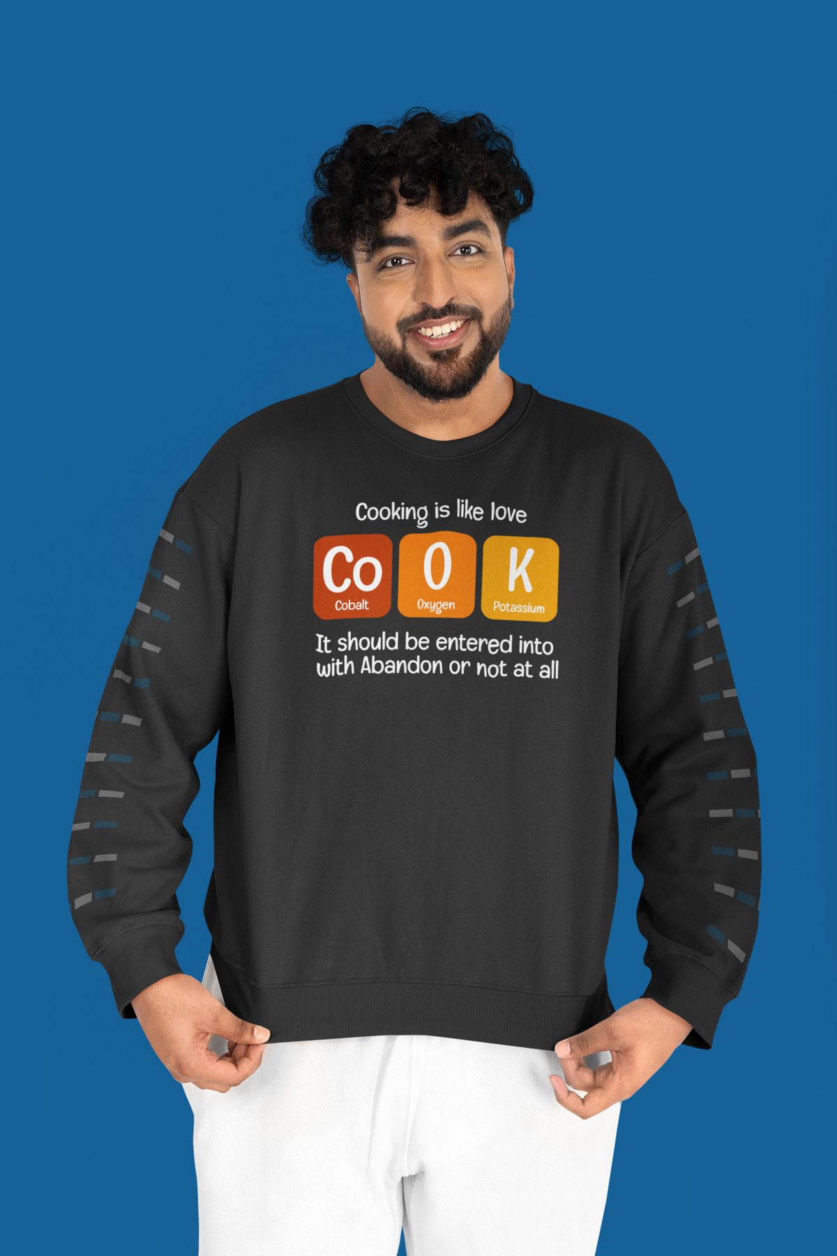 Co-O-K periodic table cook element pun crewneck sweatshirt, model wearing it in a studio shot