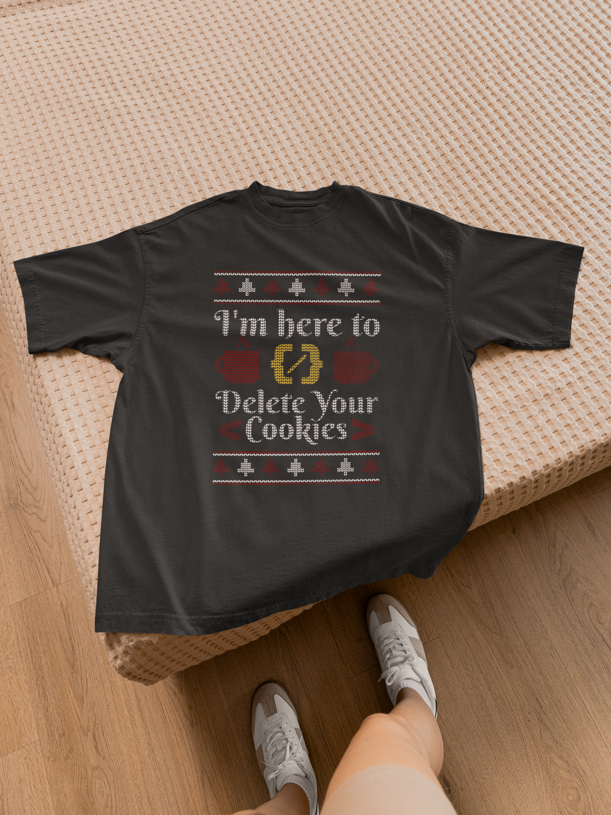 'I'm Here to Delete Your Cookies' Women's T-Shirt in black, flat lay on a bed with sneakers, tech gift
