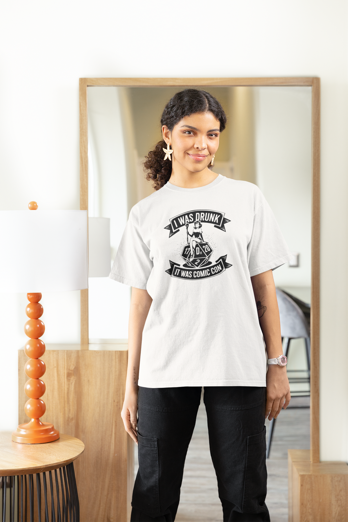 'I Was Drunk It Was Comic Con' womens tee in white, woman standing in living room, funny convention gift