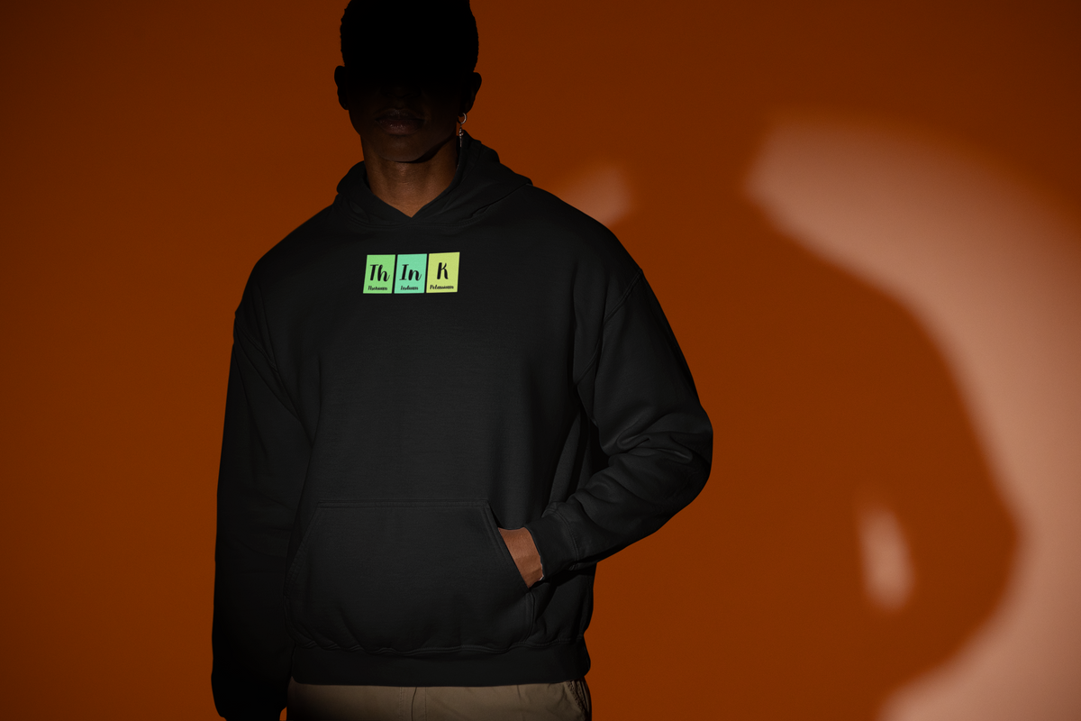 'Th-In-K Periodic Table Hoodie' in black, man under a spotlight, Hoodie mockup, Geekpsters