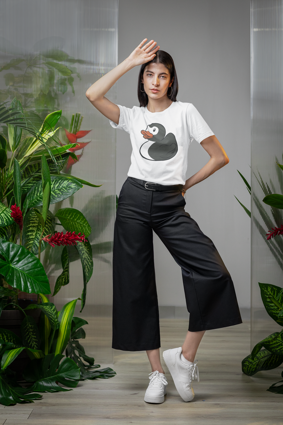 Super Duck t-shirt in white, woman model wearing it among green plants, funny duck lover gift