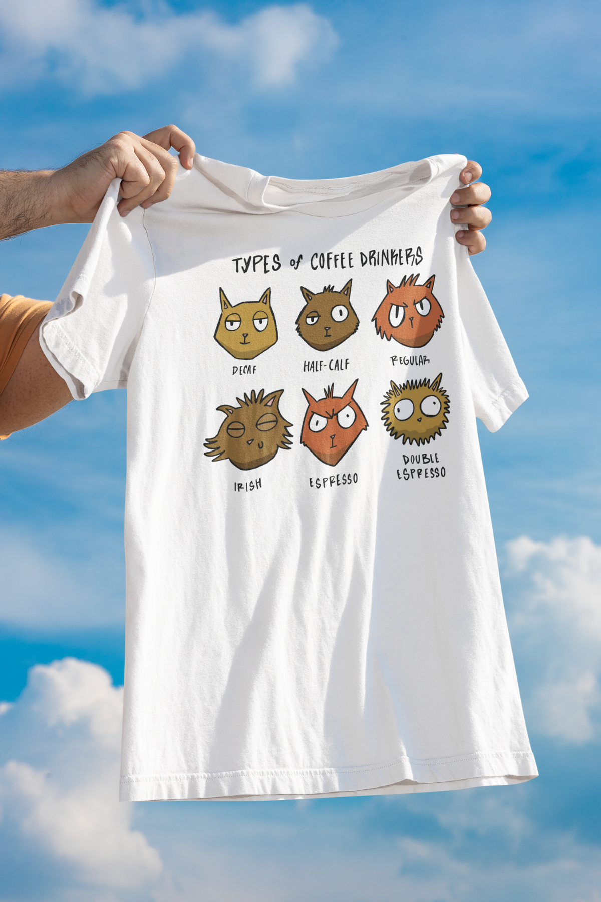 'Types of Coffee Drinkers' owl t-shirt in white, held up outdoors, funny gift for coffee lovers