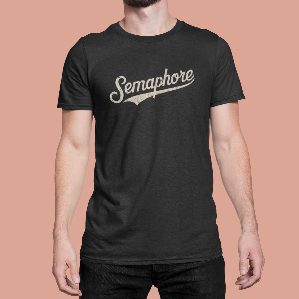 Semaphore script logo t-shirt in black, man wearing it on a pink background, trendy coder pun gift