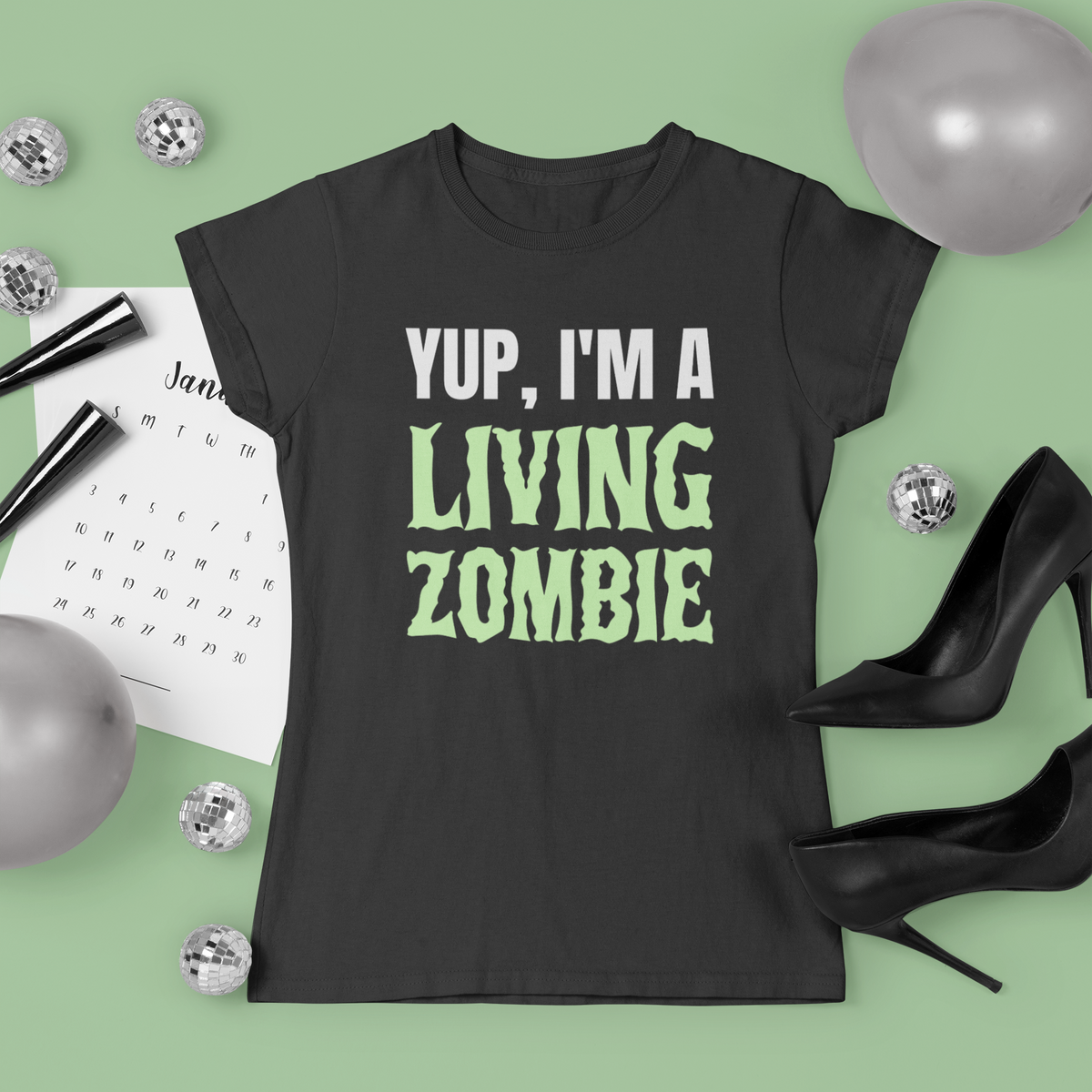 'Yup, I'm a Living Zombie' t-shirt in green, flat lay front on hanger, funny zombie tee gift idea