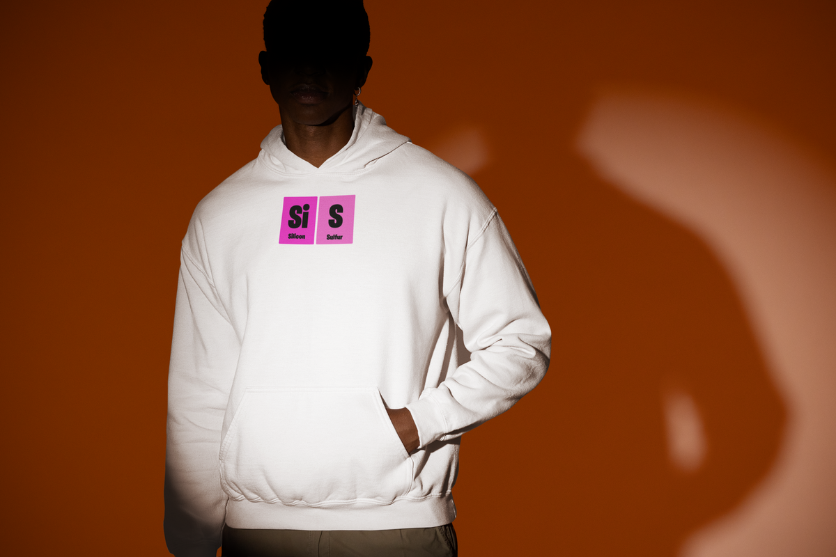 'Si-S Periodic Table Hoodie' in white, man under a spotlight, Hoodie mockup, Geekpsters