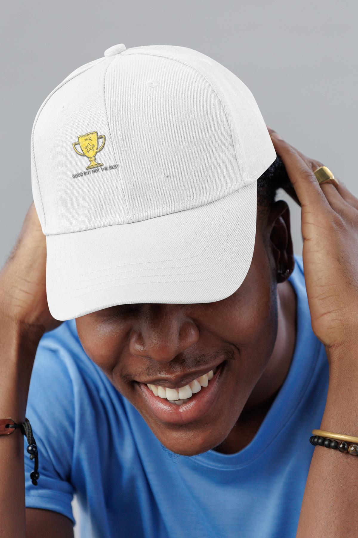 Good But Not Best trophy dad hat, smiling man in a studio, lifestyle mockup, Geekpsters