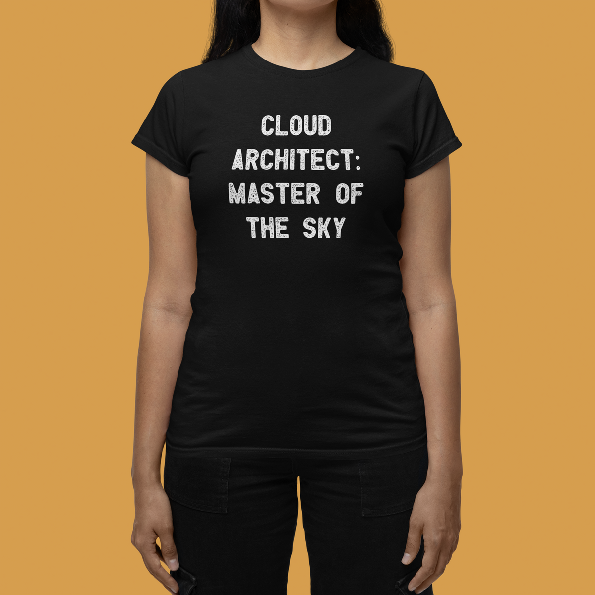 'Cloud Architect: Master of the Sky' women's tee in black, woman wearing it on tan background, funny gift