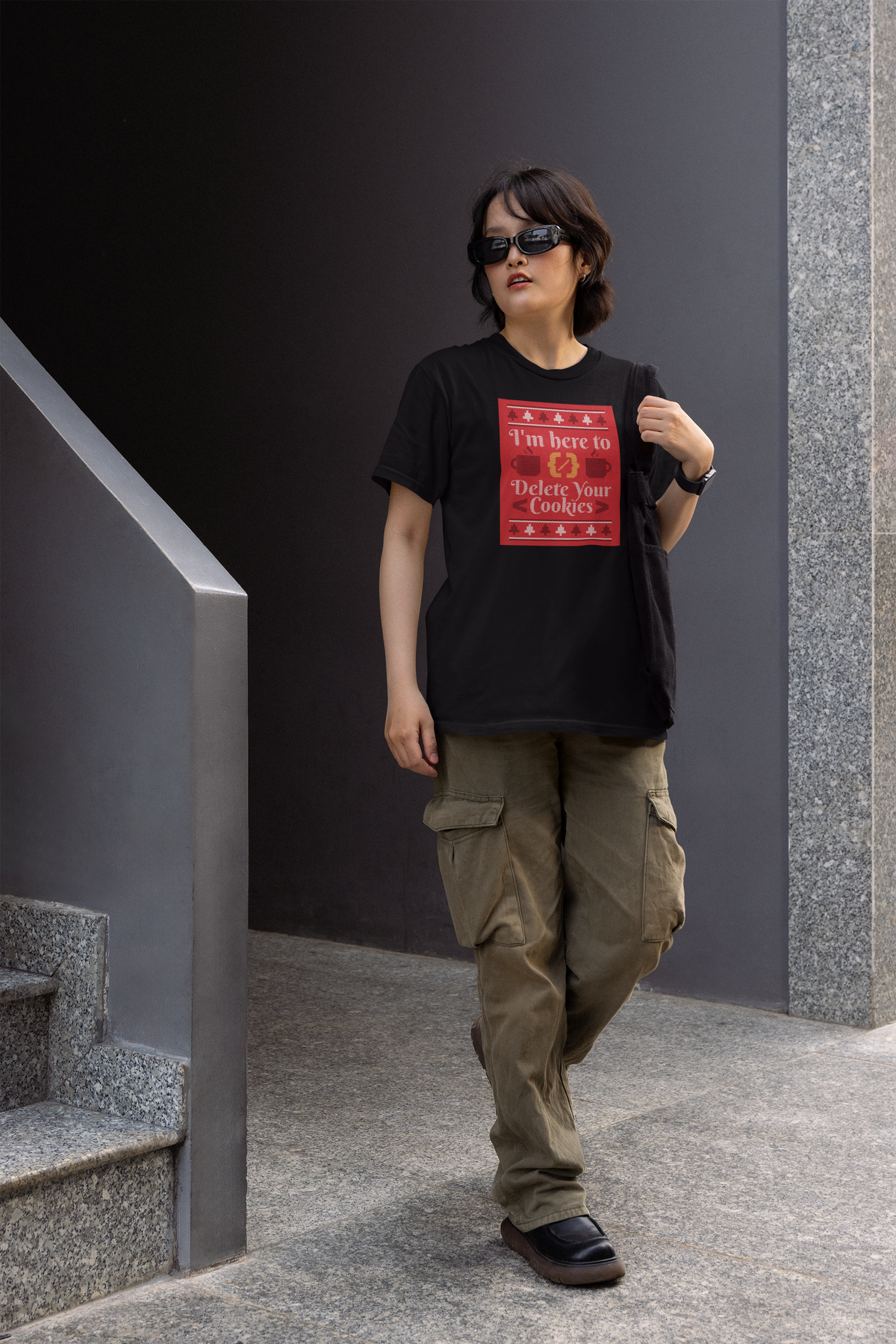 'I'm Here to Delete Your Cookies' Women's T-Shirt in black, woman walking outdoors wearing it, developer gift