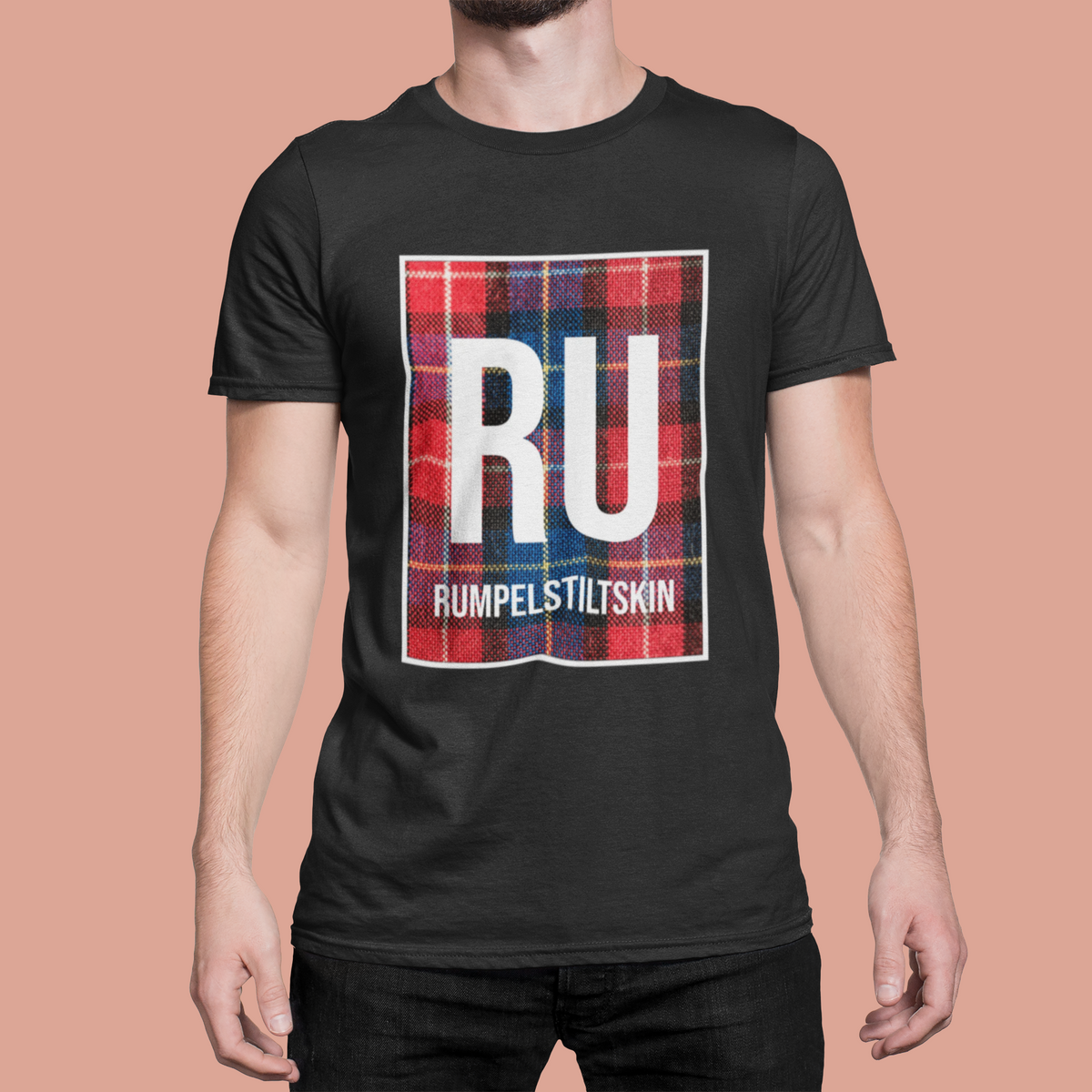 'RU Rumpelstiltskin' periodic table t-shirt in black, man wearing it on pink background, funny pun gift