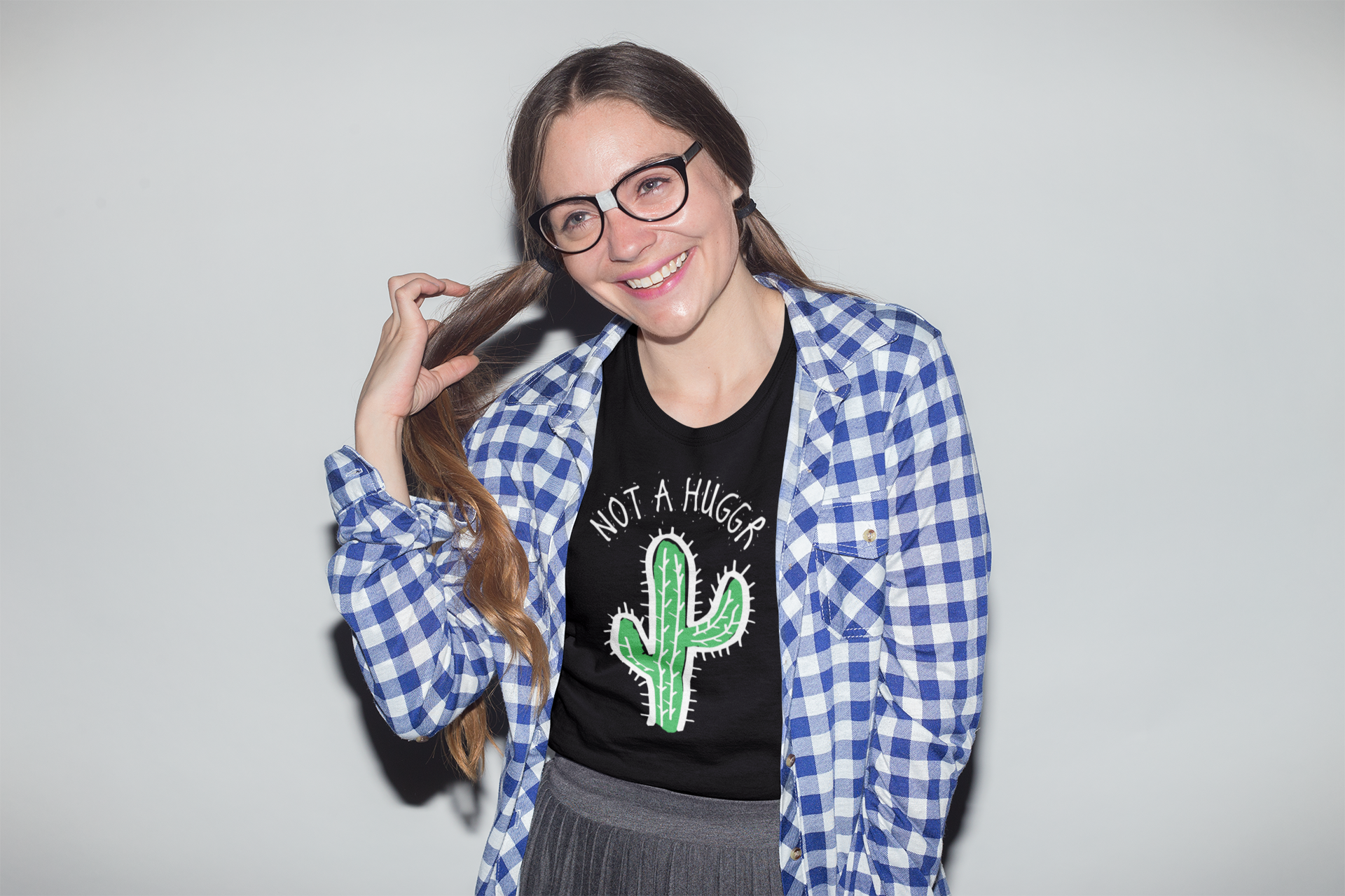 A geeky woman wearing a "not a hugger" T shirt