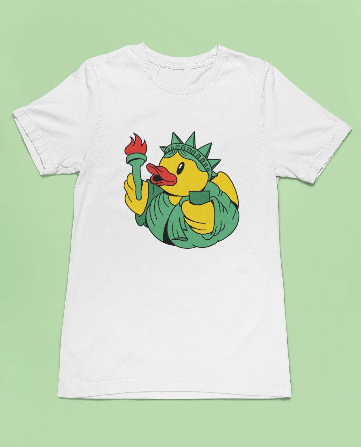 Liberty duck t-shirt in white, flat lay on a light green background, funny gift for duck lovers
