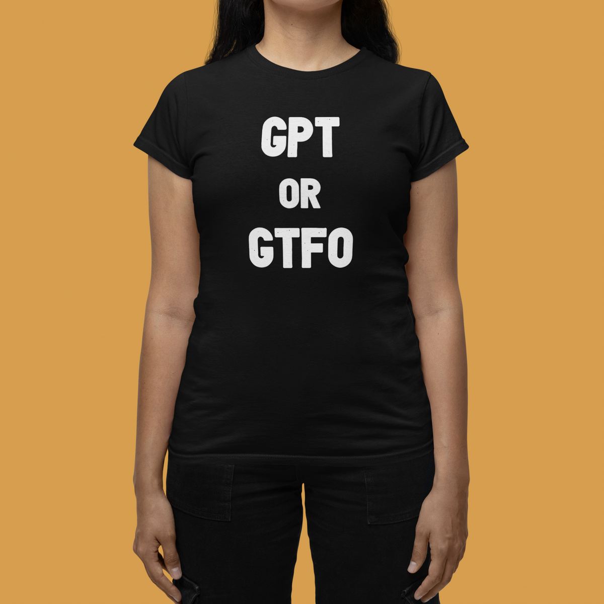 'GPT or GTFO' women's tee in black, close-up on woman wearing it, orange background, funny AI gift