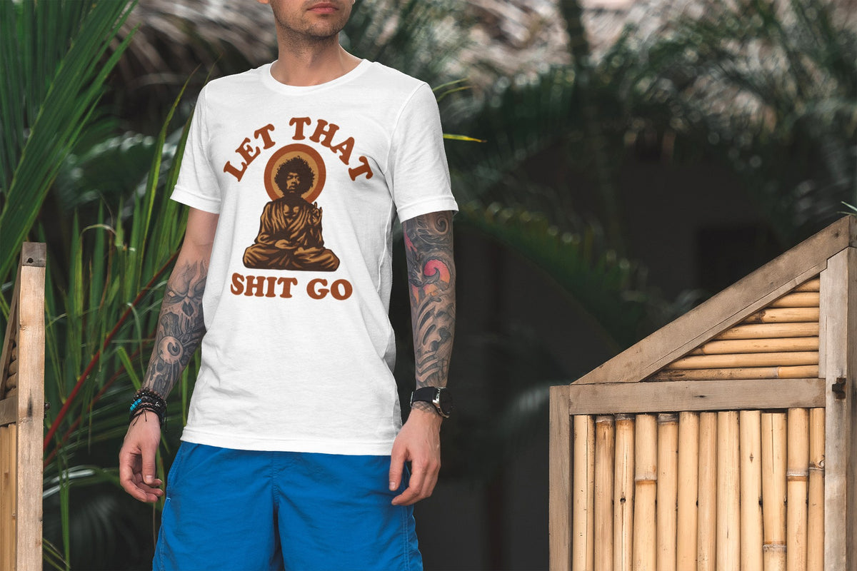 Let That Shit Go tee in white, man outdoors among palms, funny mindfulness gift shirt