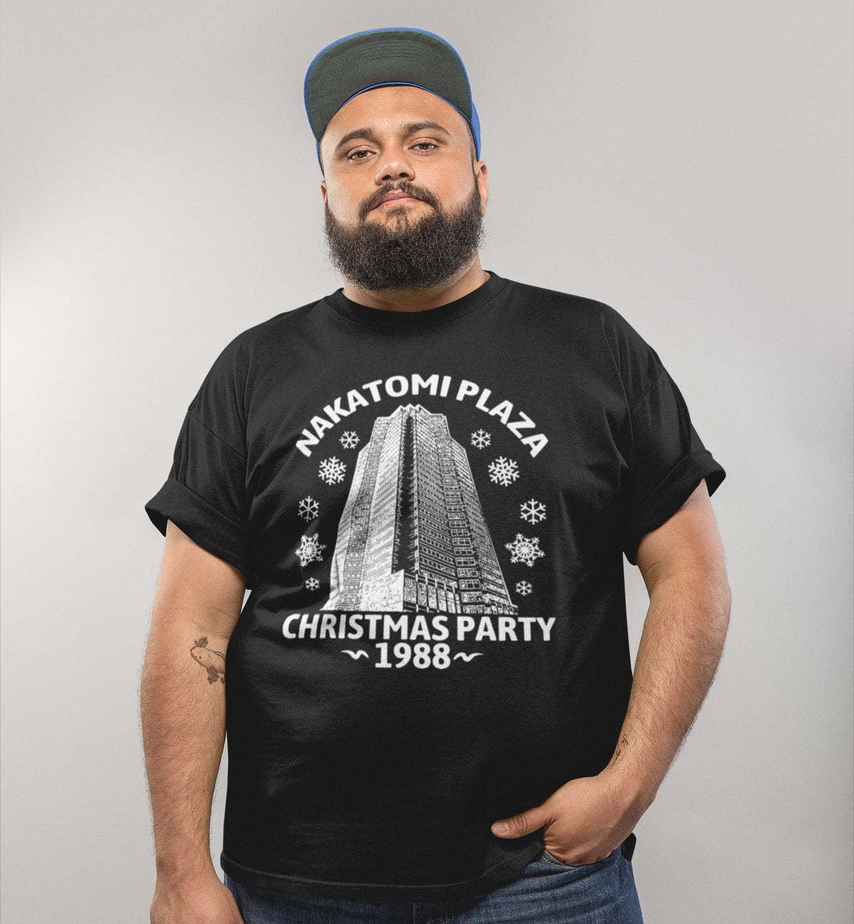 Nakatomi Plaza Christmas Party 1988 tee in black, bearded man in a beanie, holiday gift