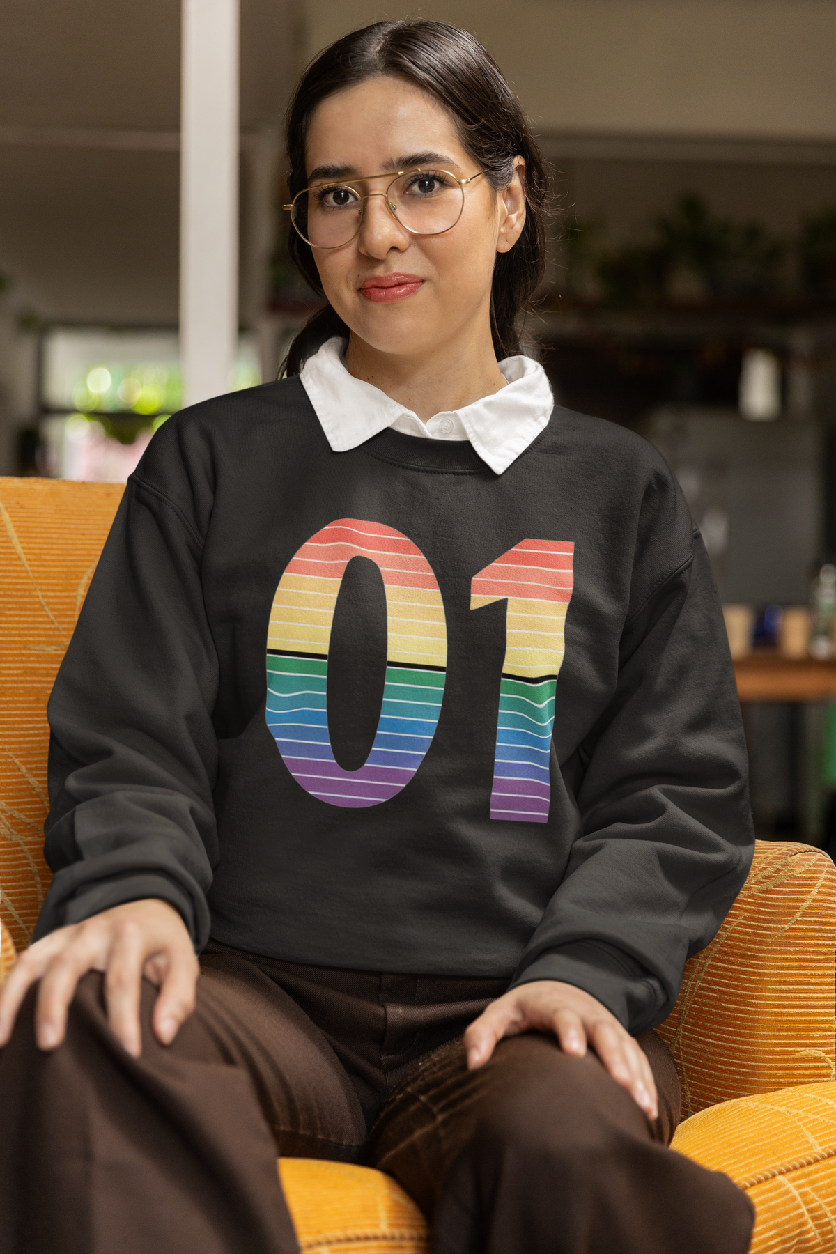 01 Binary sweatshirt in charcoal with rainbow gradient print, woman sitting wearing it, funny coder gift
