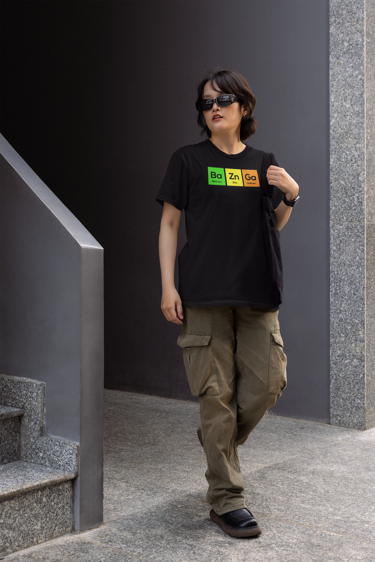 'Ba-Zn-Ga' women's fitted t-shirt in black, person wearing it outdoors on stairs, funny sitcom pun gift