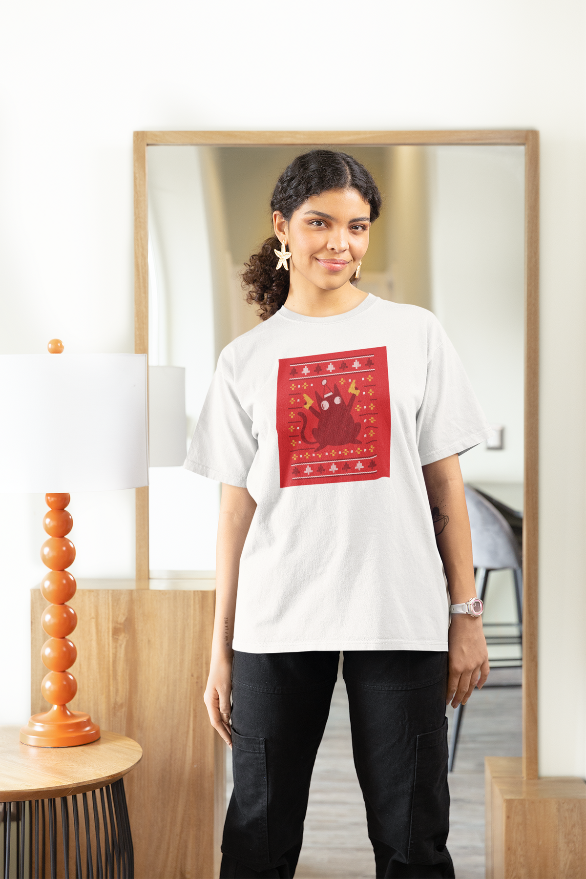 Ugly Sweater Cat Women's T-Shirt in white, woman wearing it at home by a mirror, funny cat lover gift