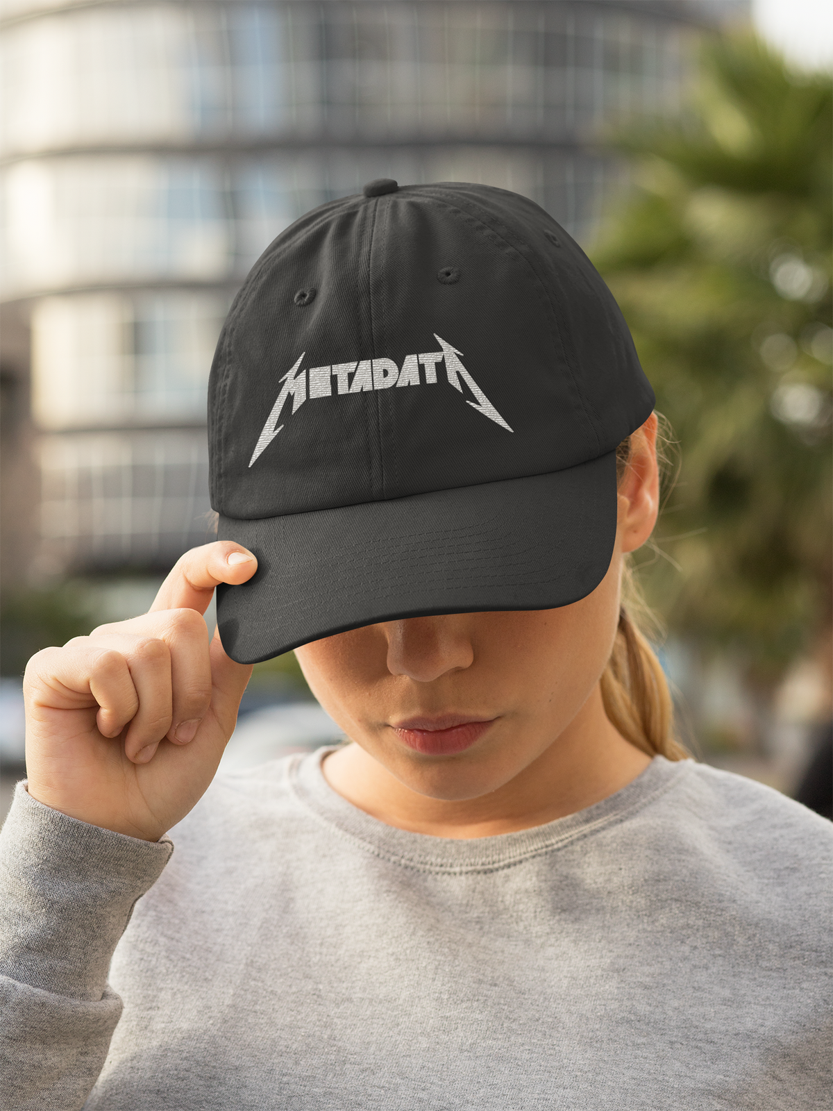'Metadata' dad hat in black, woman wearing it outdoors, funny gift for data nerds