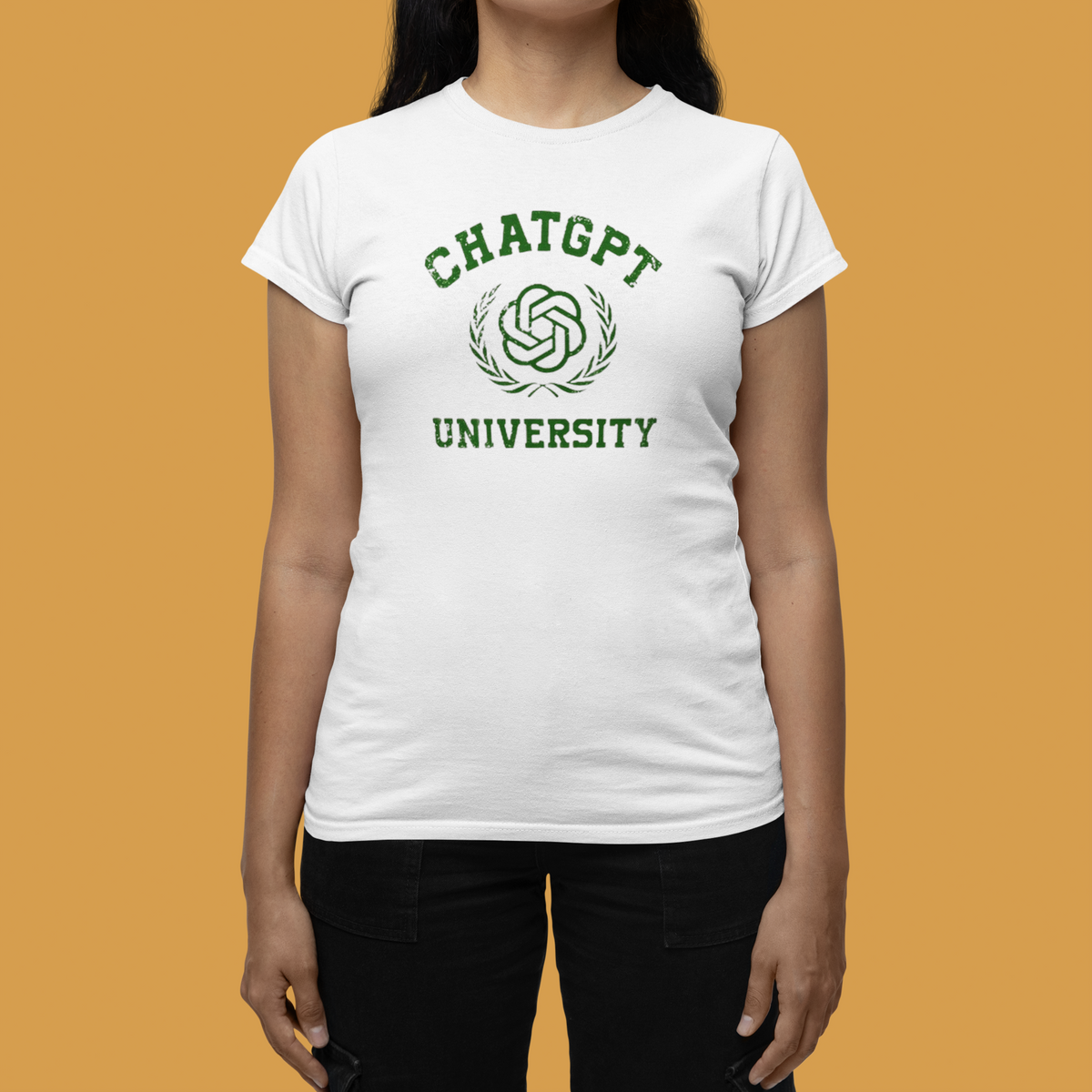 'ChatGPT University' womens tee in white, woman wearing it on mustard background, funny college pun gift