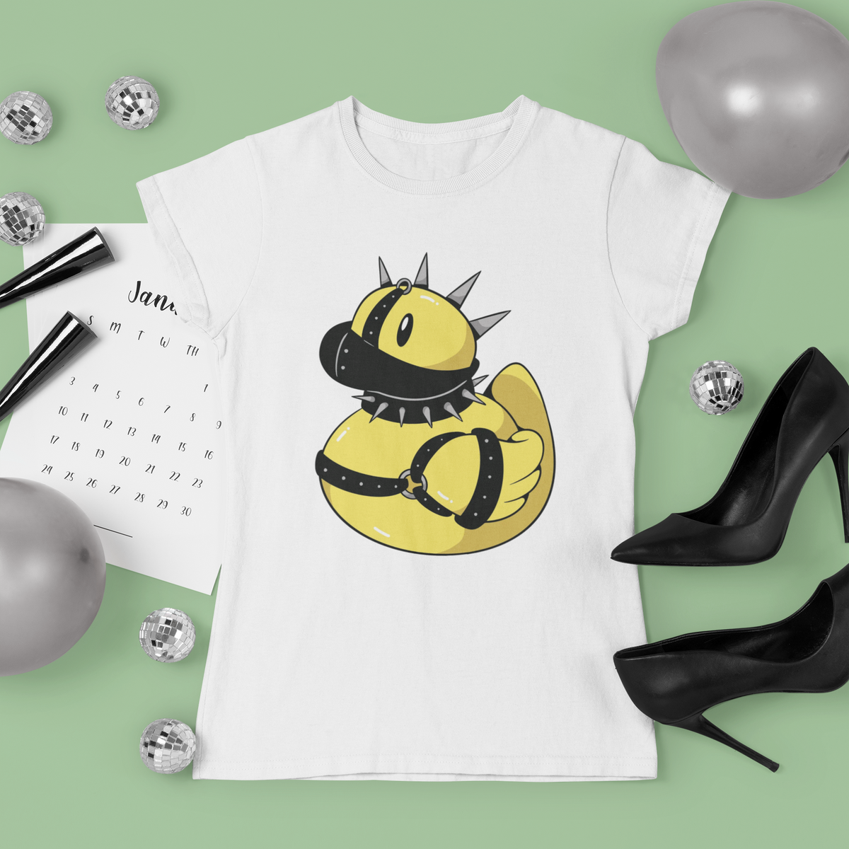 Punk spiked duck t-shirt in white, flat lay styled with disco balls and heels, funny rebel duck gift