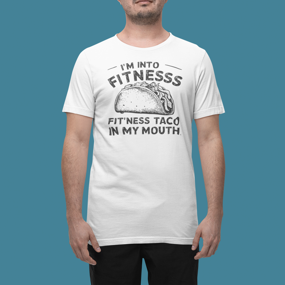 'I'm Into Fitness' t-shirt in white, man wearing it in a studio, T-Shirt mockup, Geekpsters