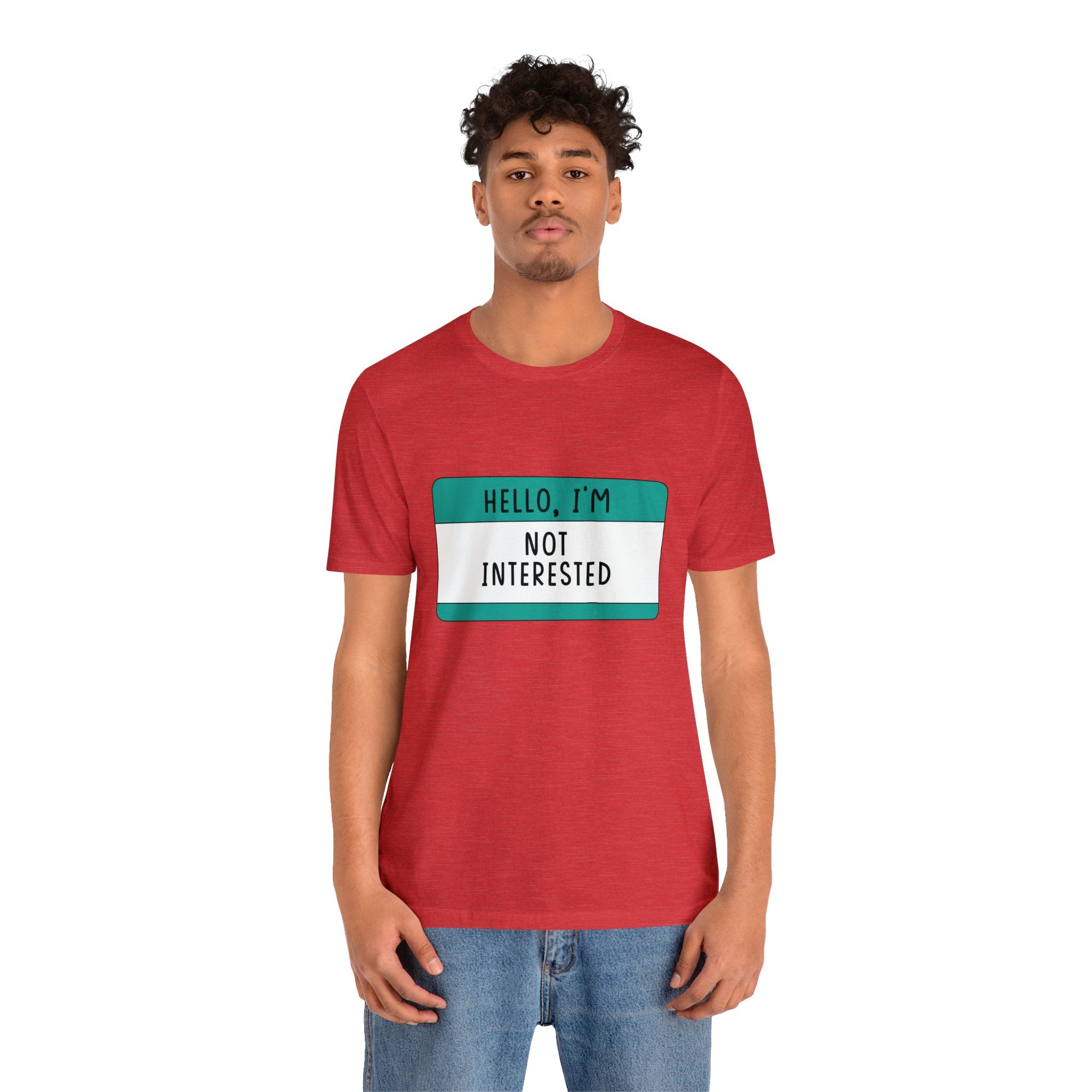A man in a red tee-shirt that says "Hello, I'm Not Interested" builds character.