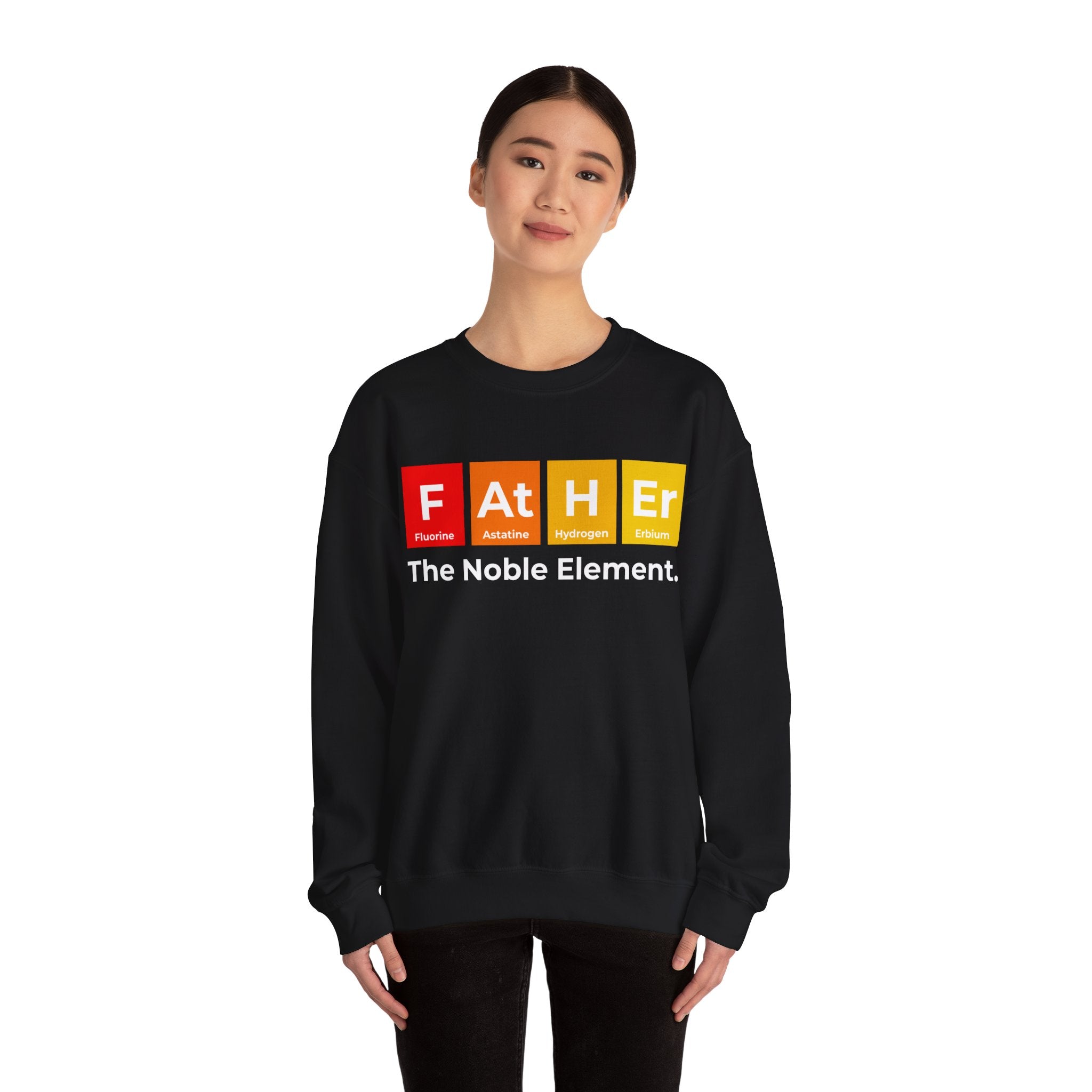 A person wearing a cozy and warm black sweatshirt with a periodic table-inspired design spells "Father" above the text "The Noble Element." Perfect for winter, this Father Graphic - Sweatshirt offers both comfort and style.
