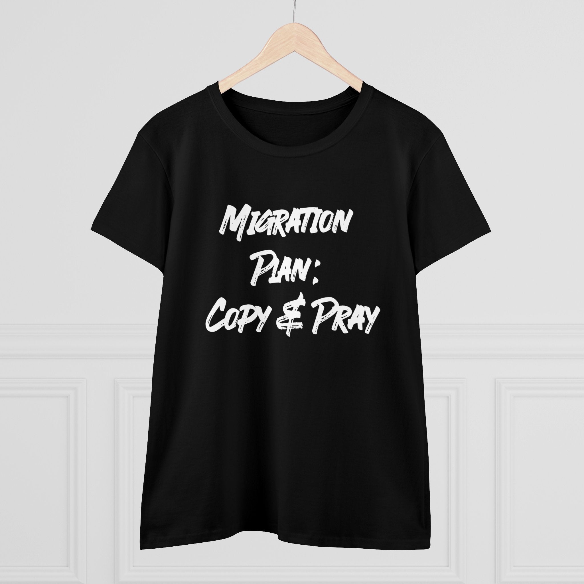 Women's tee on a hanger featuring the "Migration Plan Copy and Pray" design in bold white font.