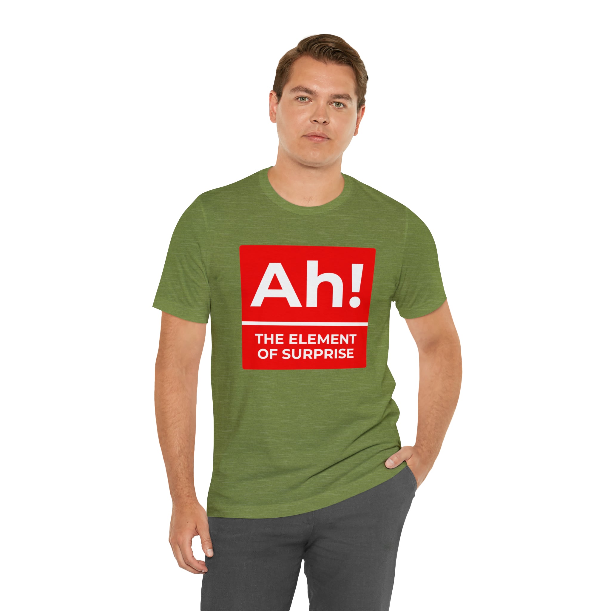 A man wearing a green Ah! the Element of Surprise T-shirt.