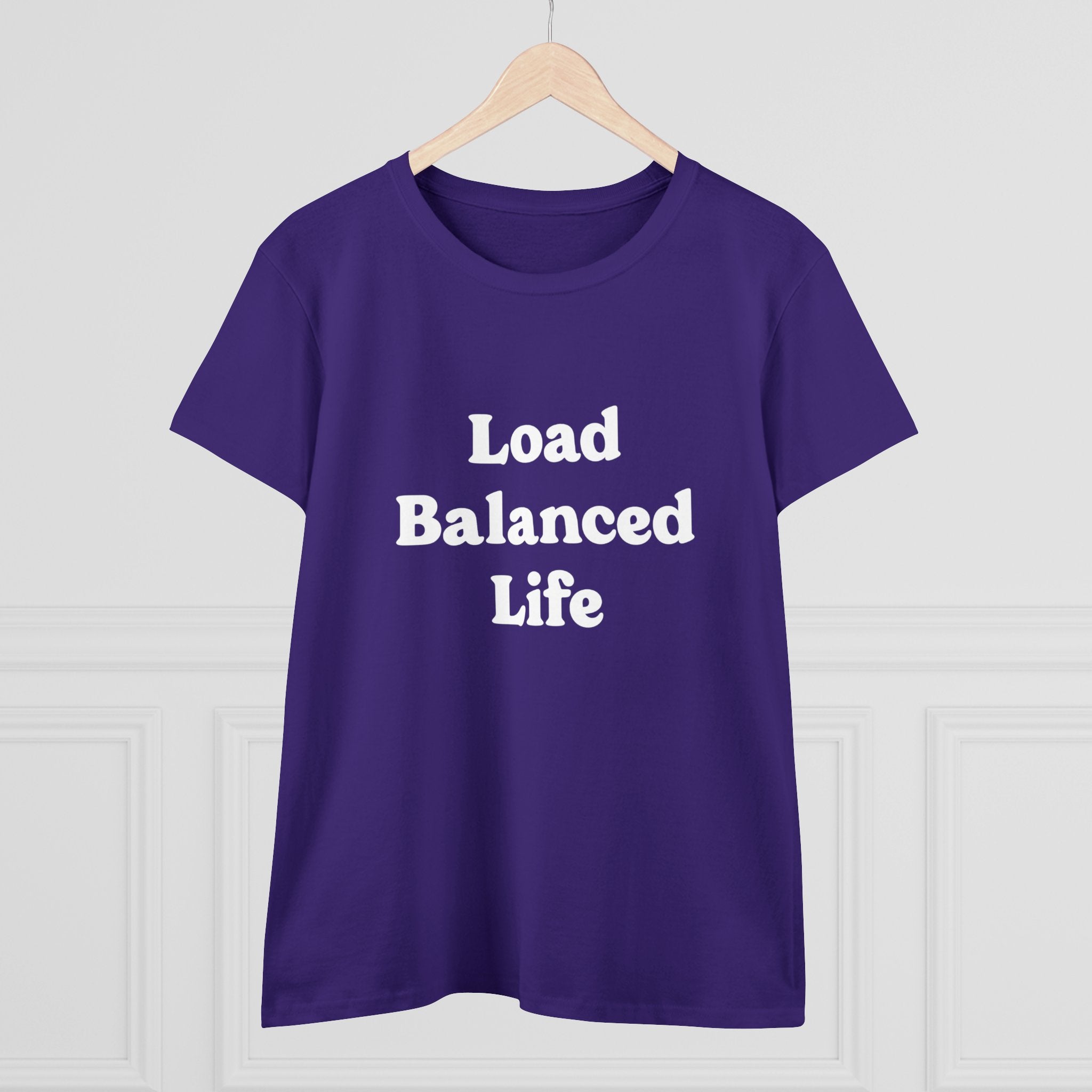 Fashionable and comfortable, the Load Balanced Life - Women's Tee is made from pre-shrunk cotton. Hung on a hanger, it boasts the phrase "Load Balanced Life" elegantly printed in crisp white on its lively purple fabric.