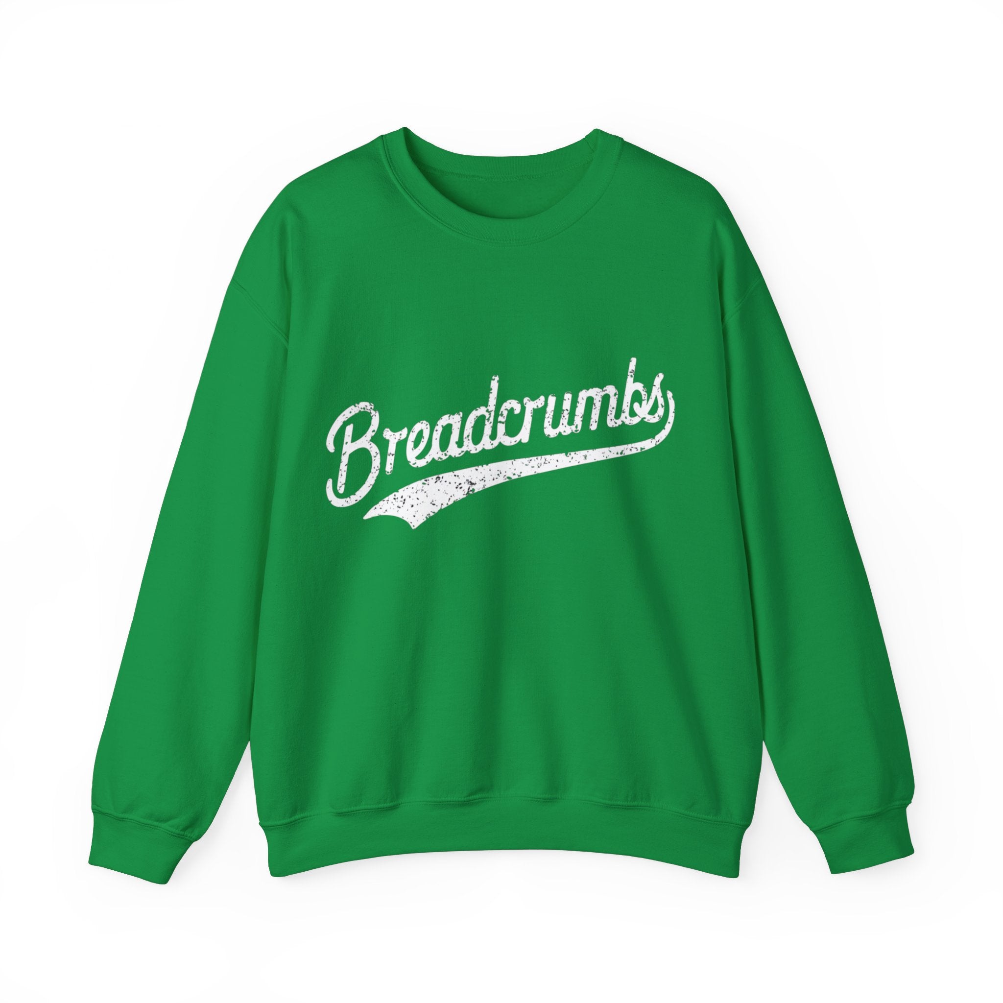 A green, cozy Breadcrumbs - Sweatshirt with the word "Breadcrumbs" written in white cursive text across the front is perfect for the colder months.