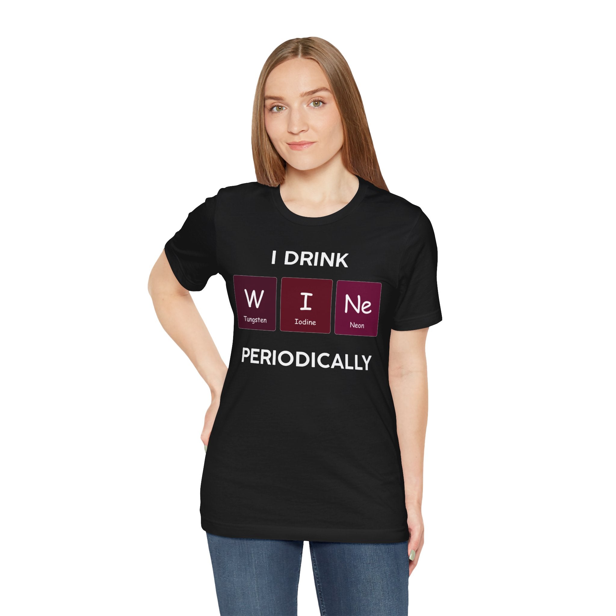 Woman in a black unisex jersey tee with "I Drink W-I-Ne" printed in white and pink, featuring elements from the periodic table.