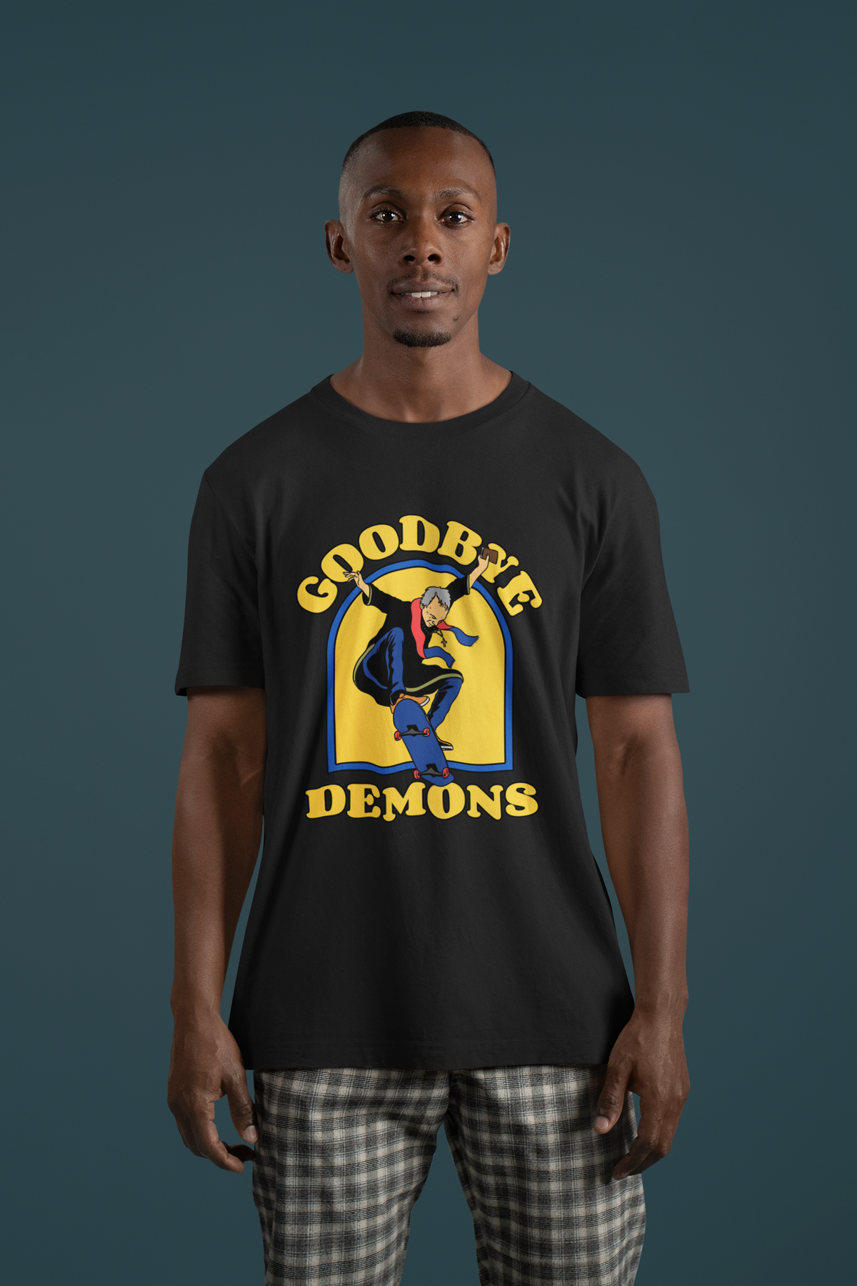 'Goodbye Demons' funny exorcist skater t-shirt in black, man wearing it studio shot, funny halloween gift