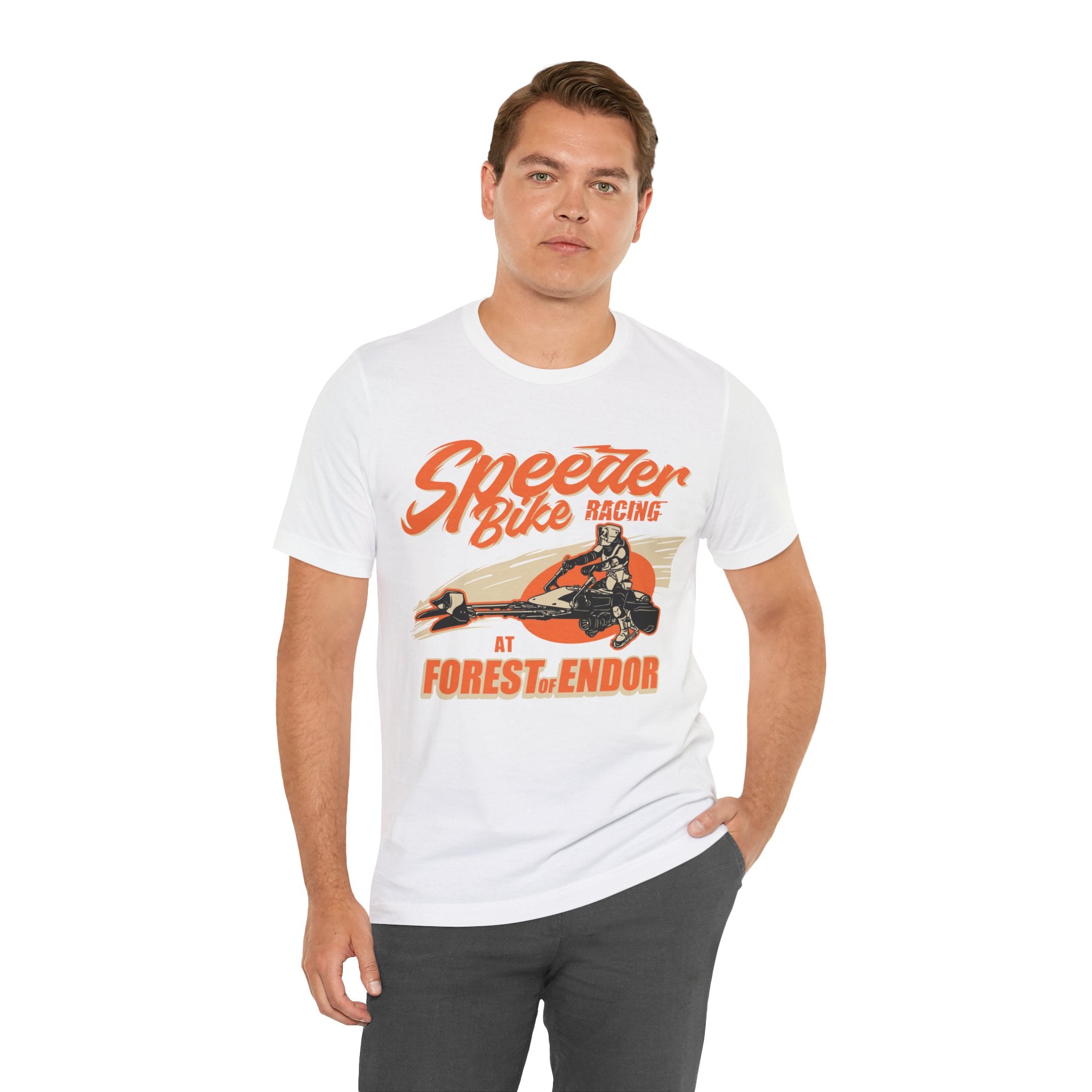 Man in a white jersey tee featuring a graphic of "Speeder Bike Racing" standing against a white background.