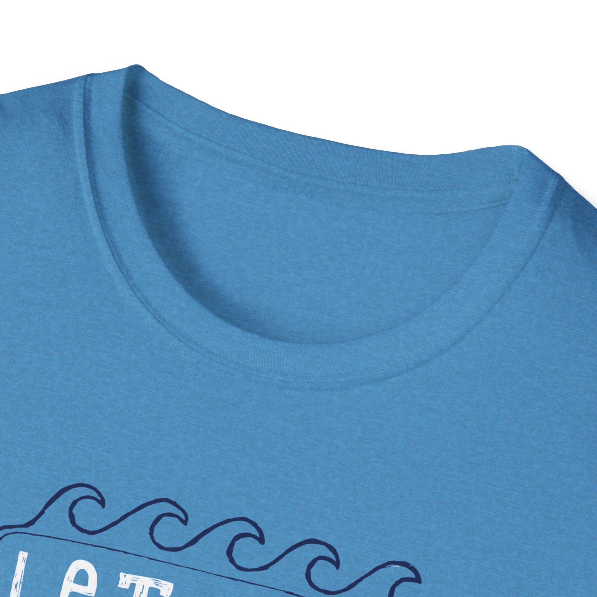 The "Let the Waves Take You On a Journey T-Shirt" features a blue color with a wave design near the hem on the right side, ideal for individuals embarking on journeys of self-discovery.