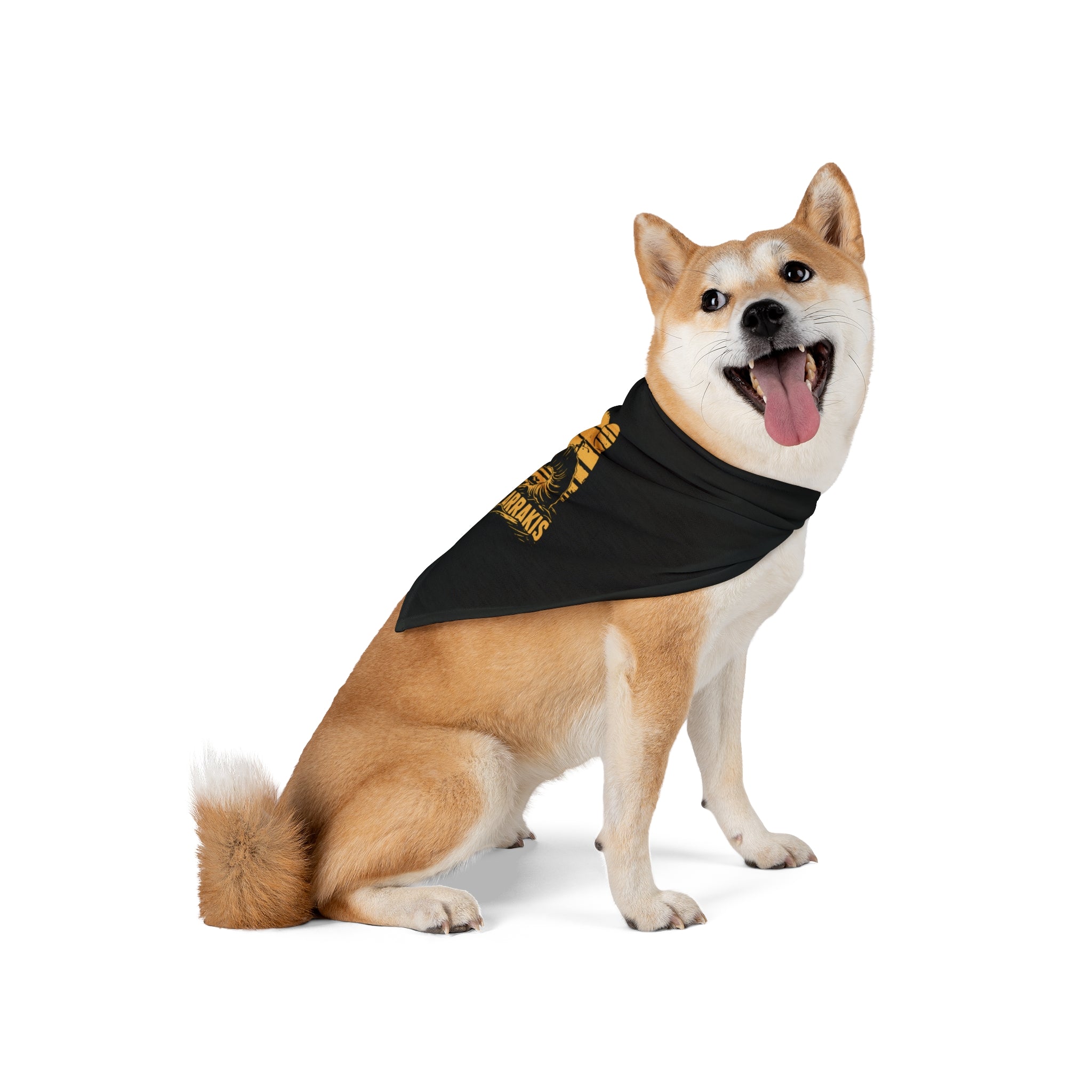A Shiba Inu dog sits with its mouth open and tongue out, sporting a Surf Arrakis - Pet Bandana made of comfy polyester, with yellow lettering against a white background.
