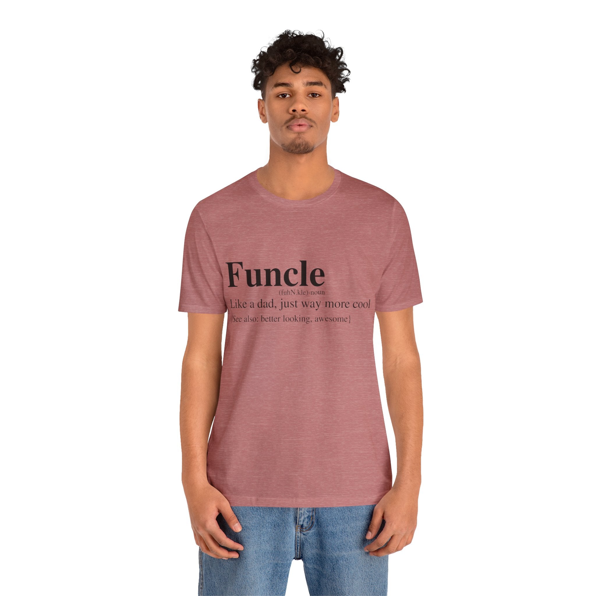 Young man wearing a Funcle T-Shirt with "Funcle: like a dad, just way more cool because i’m better looking, awesome!" printed on it, standing against a plain background.