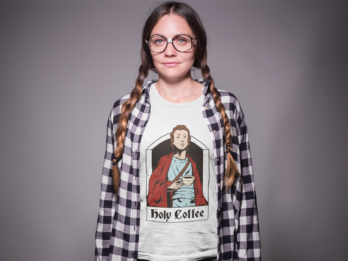 'Holy Coffee' saint t-shirt in white, woman in glasses wearing it