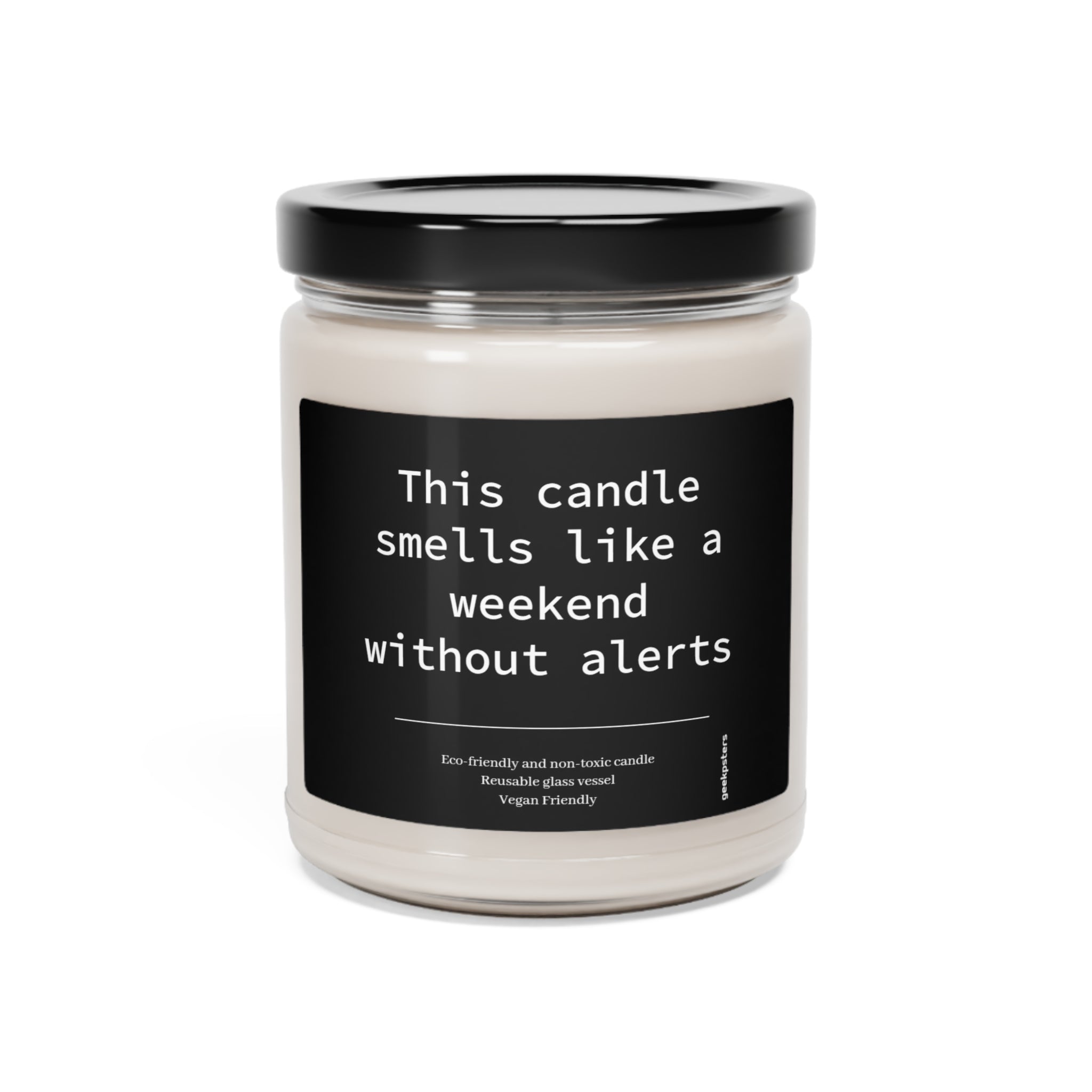 Scented soy candle with humorous label "this candle smells like a weekend without alerts", eco-friendly and vegan friendly, encased in a glass jar.